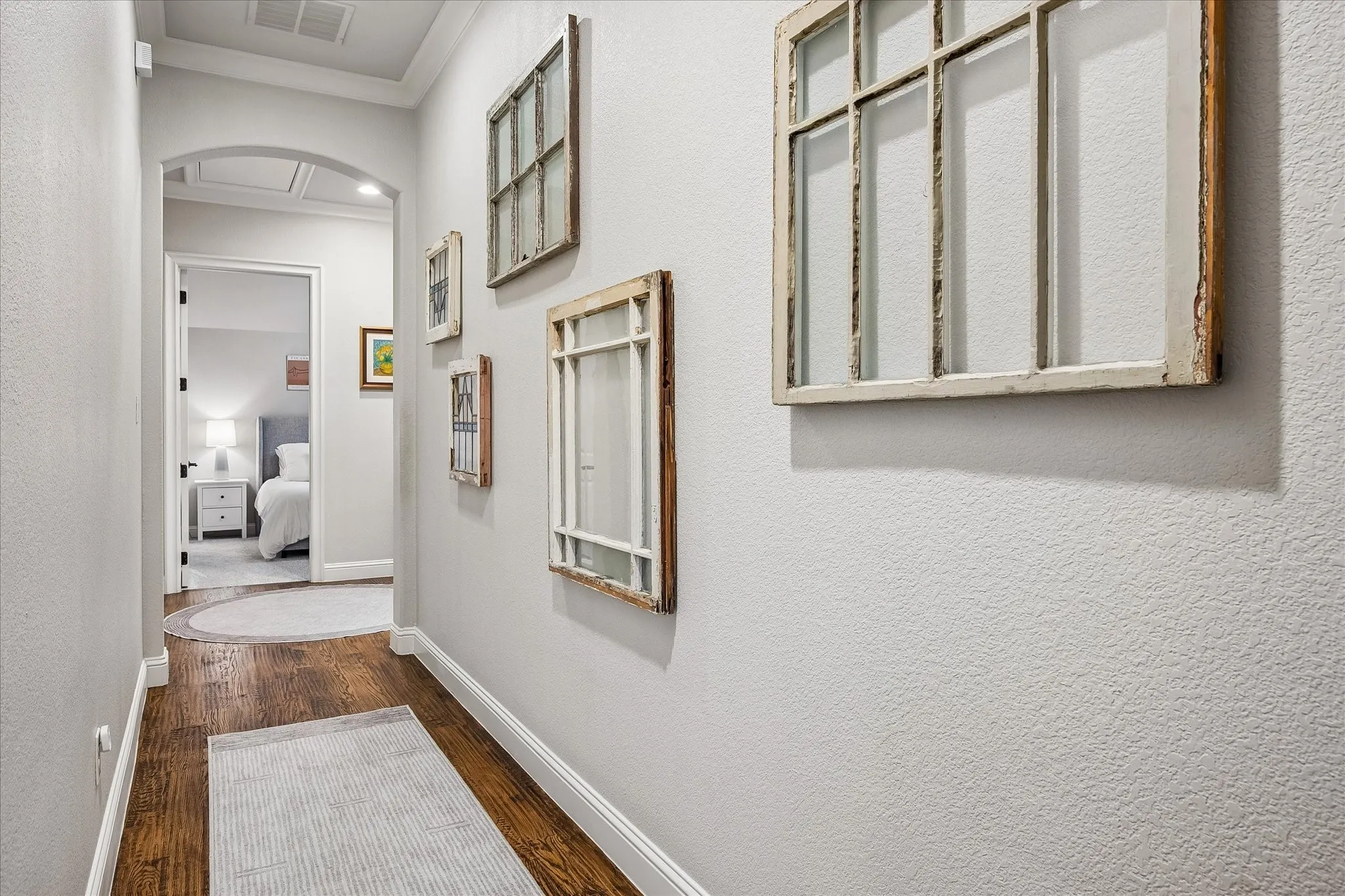 Upstairs hallway with hardwood flooring