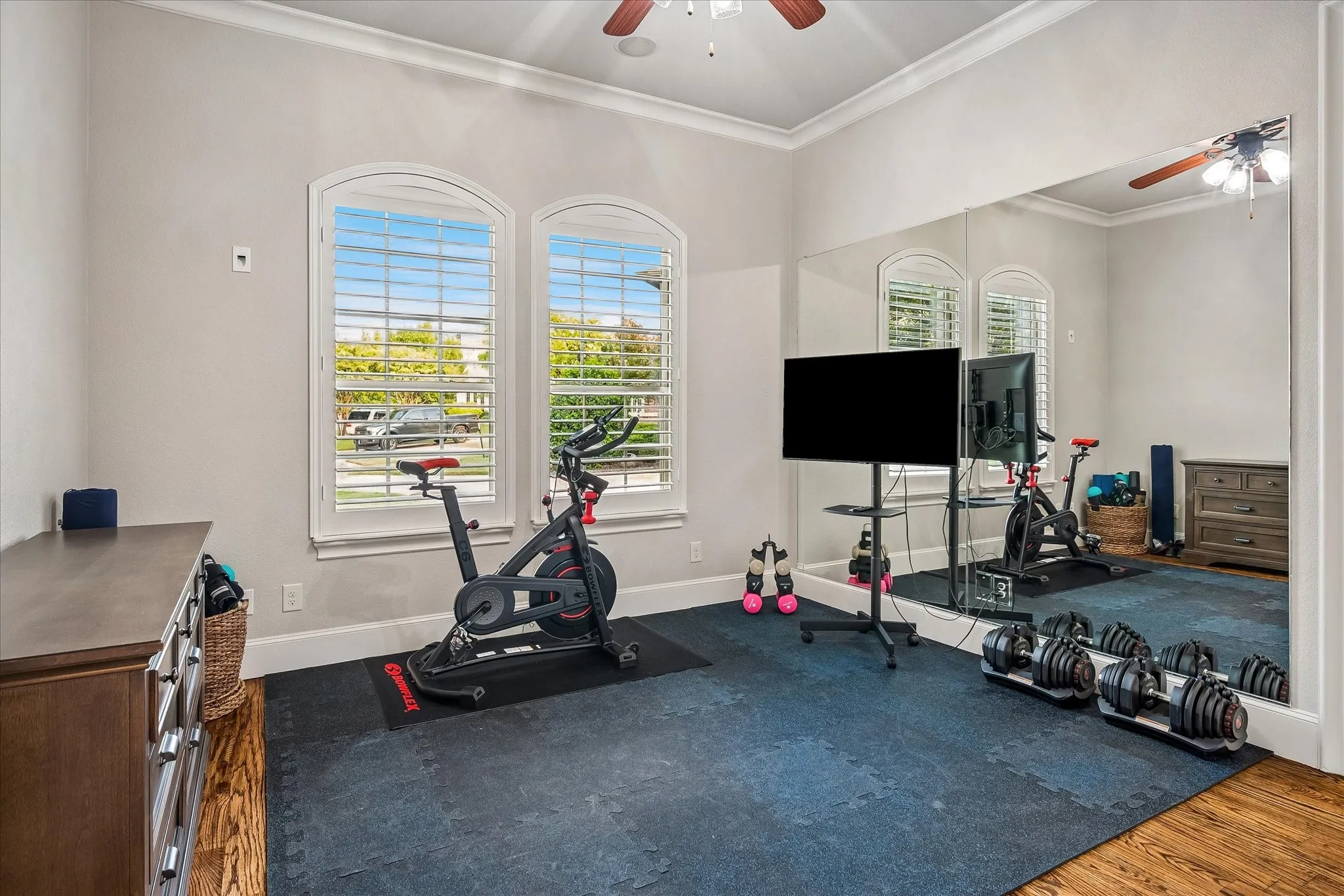 Bedroom on the mail level being used as a workout room.