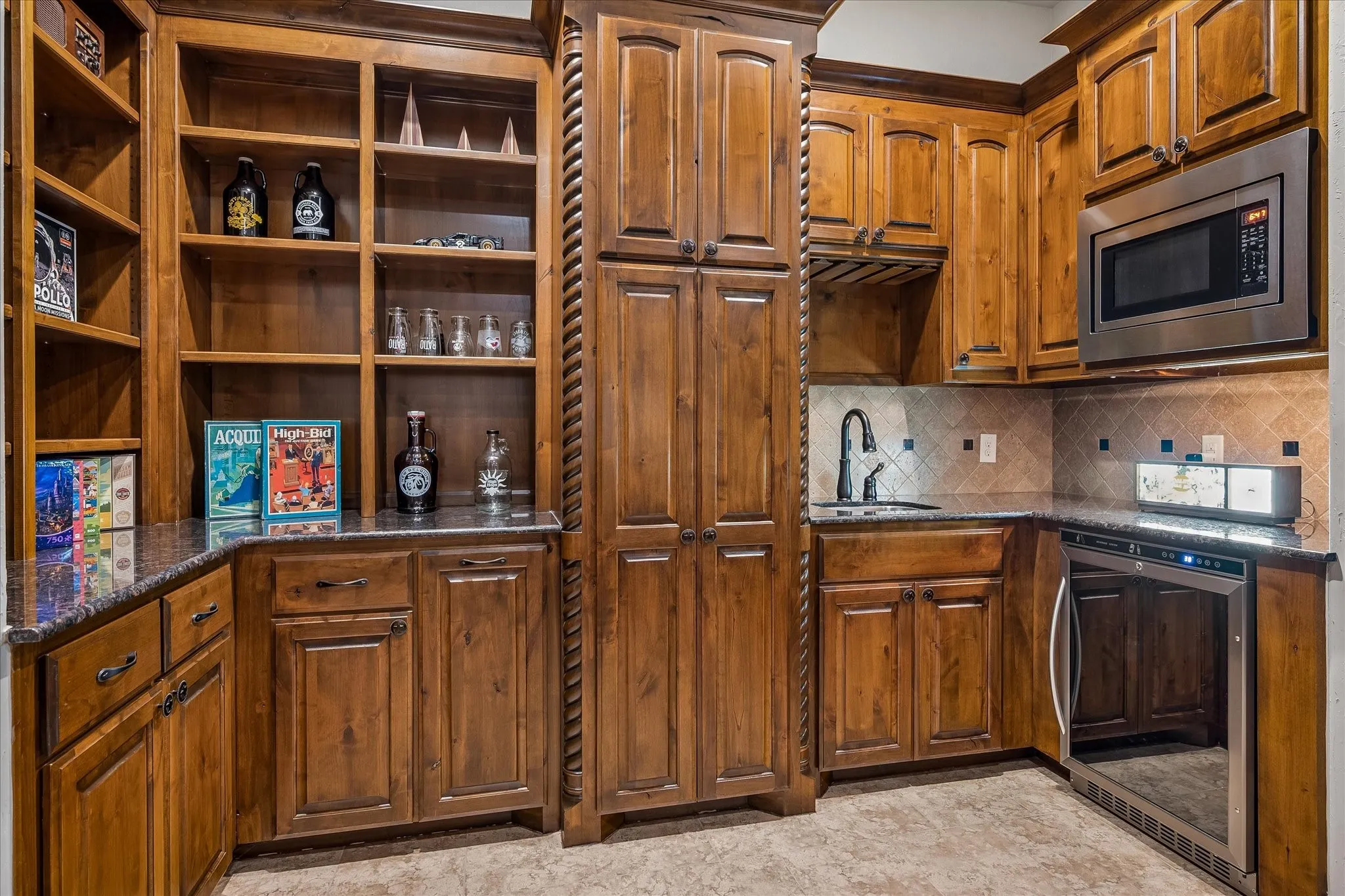 Wet bar in upstairs living area with water filtration system.