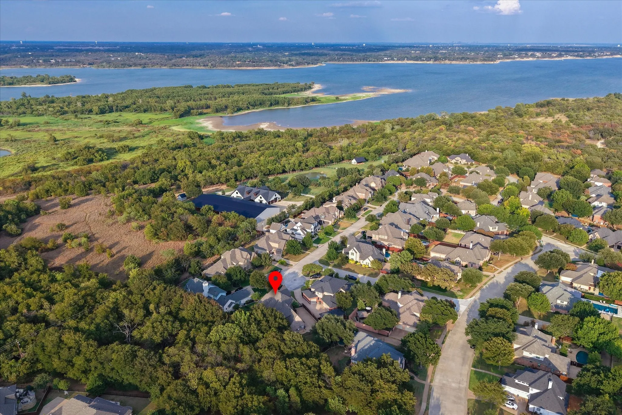 Nestled on a quiet cul-de-sac in Eagles Ridge Phase II, this meticulously maintained custom home backs to heavily wooded parkland with direct gated access to Trophy Club's renowned trail system — and no HOA.
