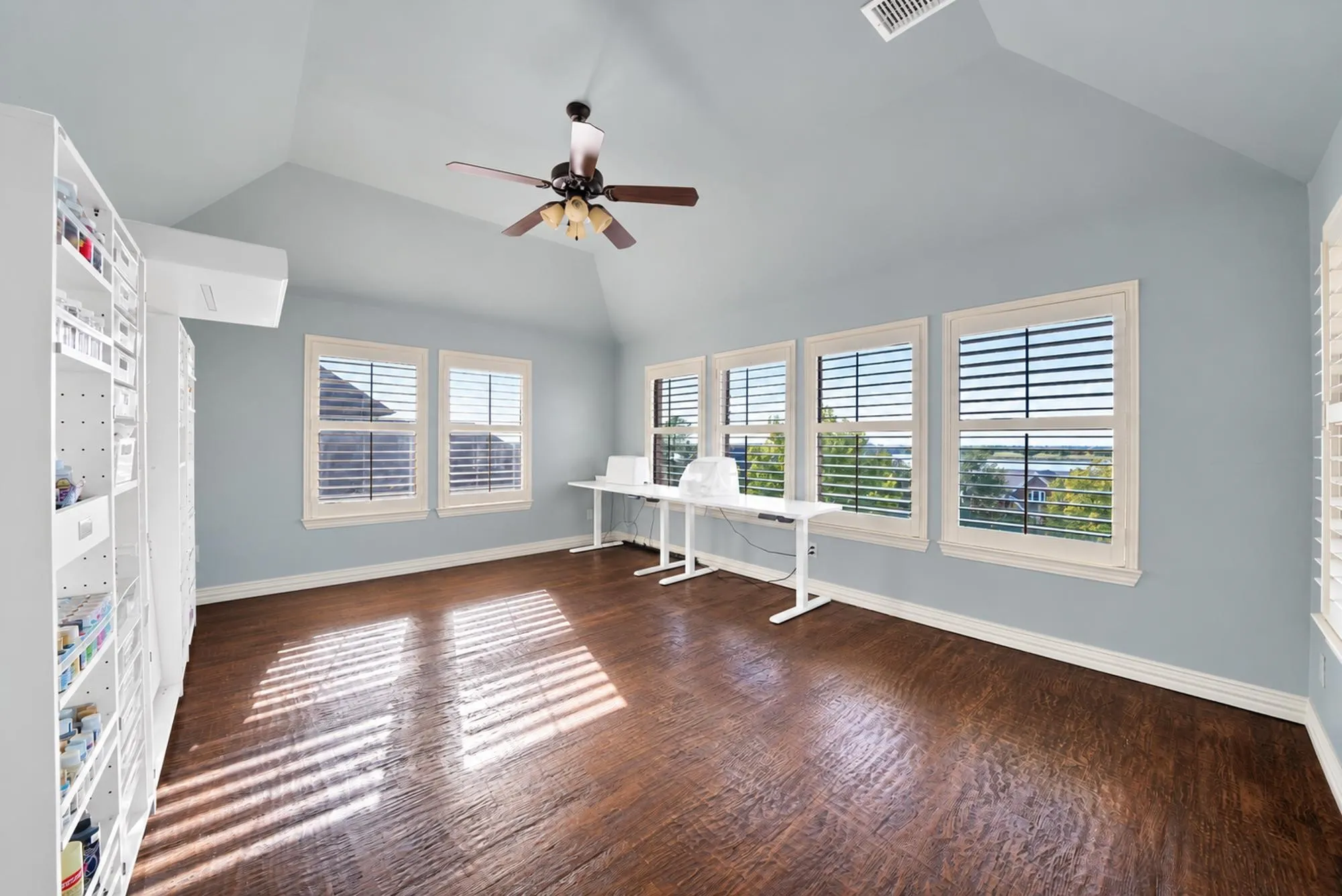 Game room that is currently used as a craft area, offers exceptional lake views. With its flexible design, the space can easily adapt to suit a variety of needs and lifestyles.