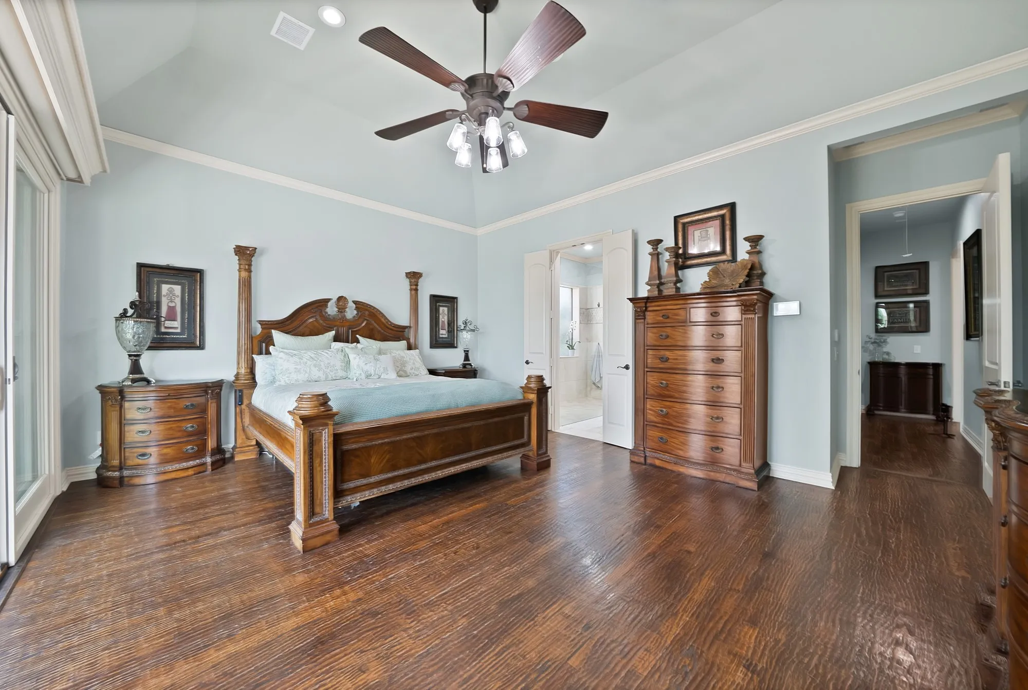 A truly impressive and private primary suite offers generous space, exceptional outdoor views, and a motorized blackout screen for peaceful mornings when you want to sleep in.