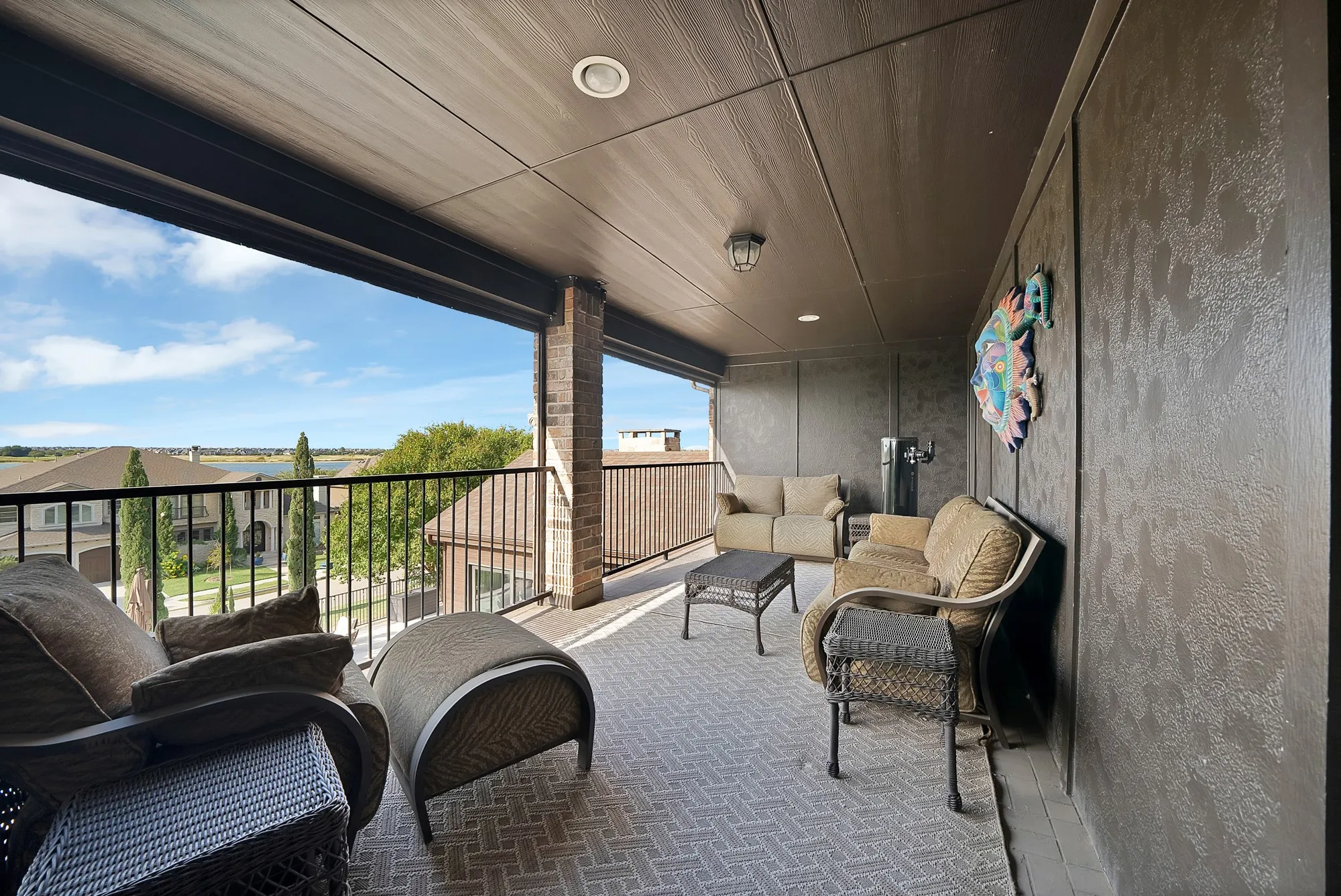 A breathtaking balcony patio offers stunning views and electric screens for added comfort and privacy, creating the perfect setting for peaceful mornings with coffee or relaxing evenings while taking in the beautiful surroundings.

