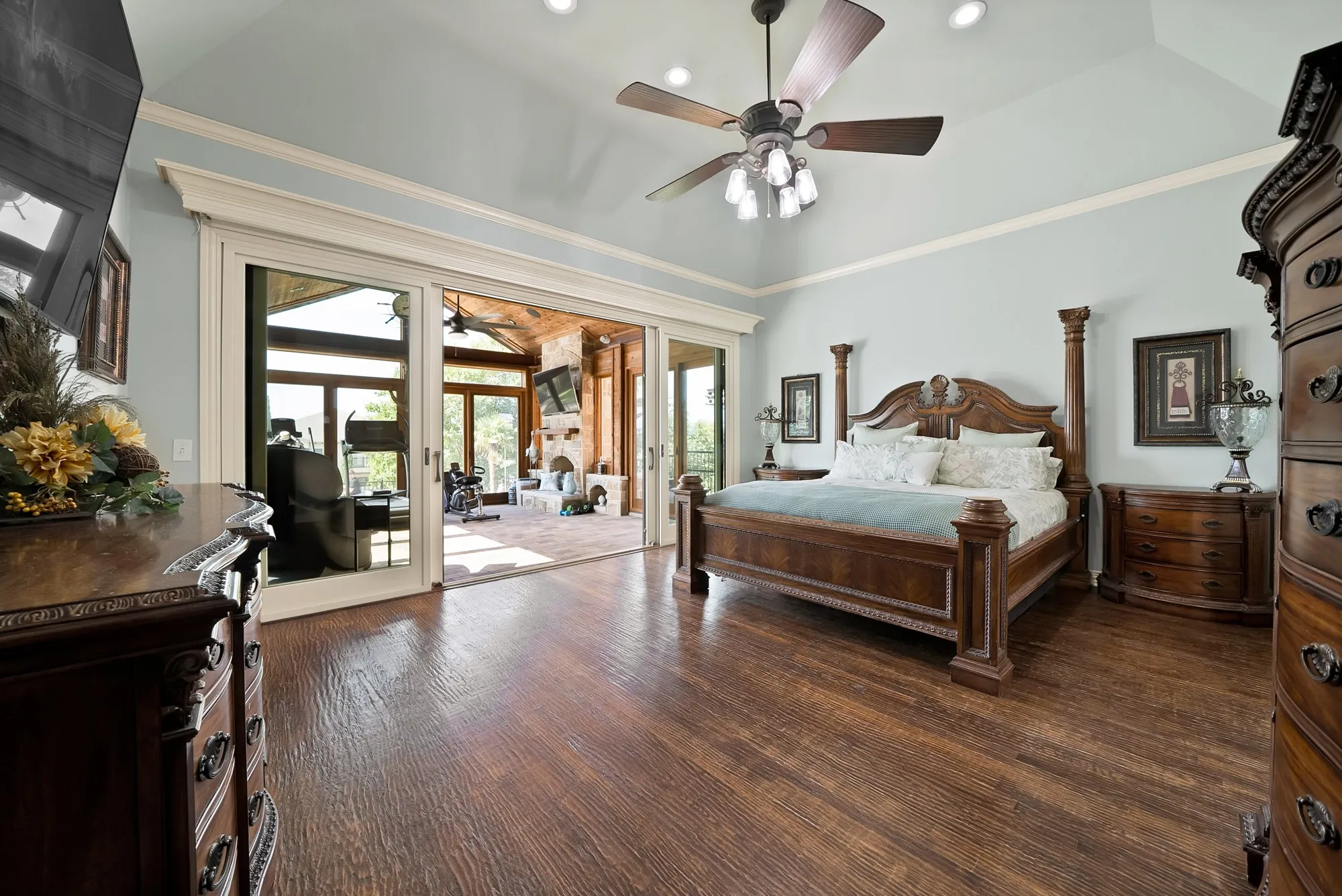 The primary suite also opens to an expansive enclosed atrium, creating a private retreat that beautifully blends indoor comfort with the outdoors.