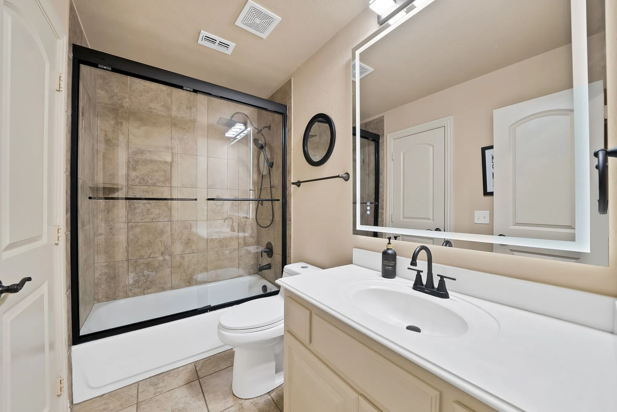 Upstairs Jack and Jill bathroom, beautifully updated space features modern finishes and thoughtful details that blend style, comfort, and functionality.
