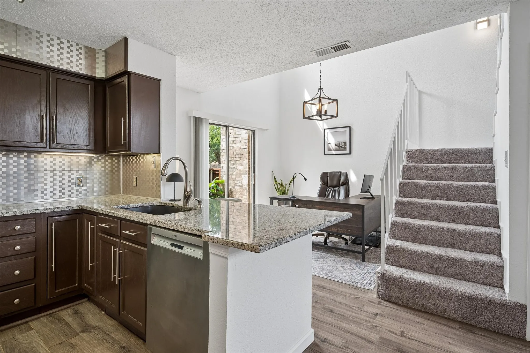 Open floorplan with kitchen opening to study/dining room area makes this a comfortable place to call home!