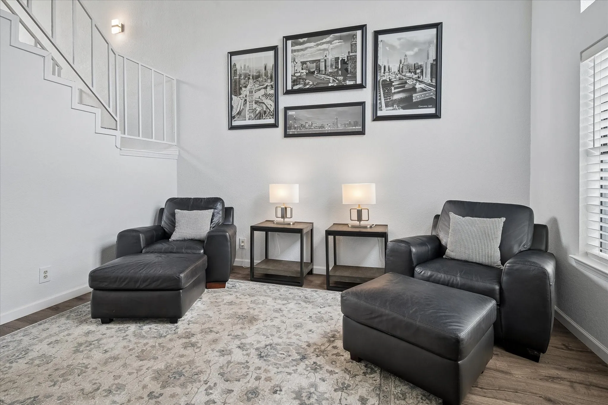 Stairway leading to upstairs opens to living and dining areas.