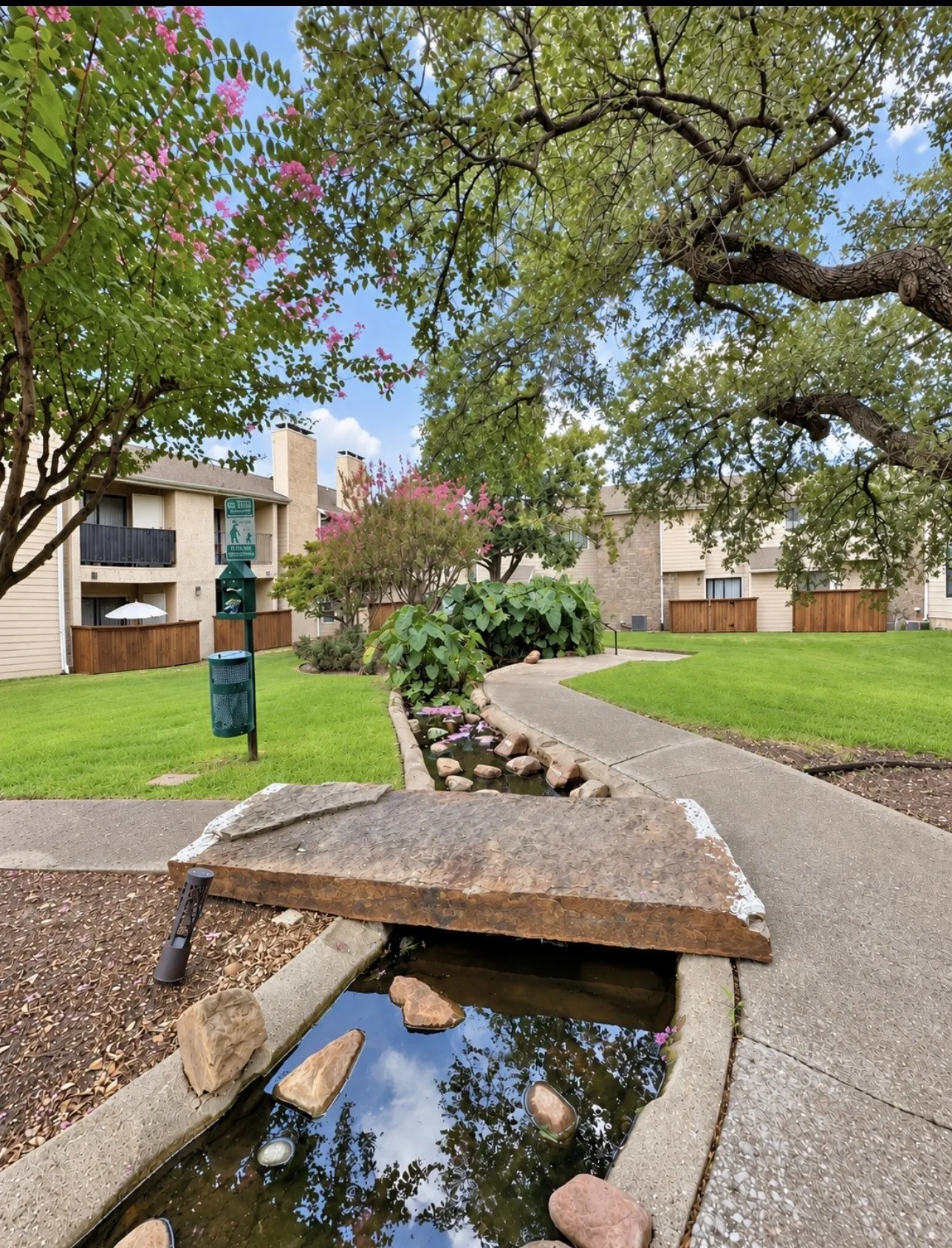 Path leading to Koi pond and another grassy community area.