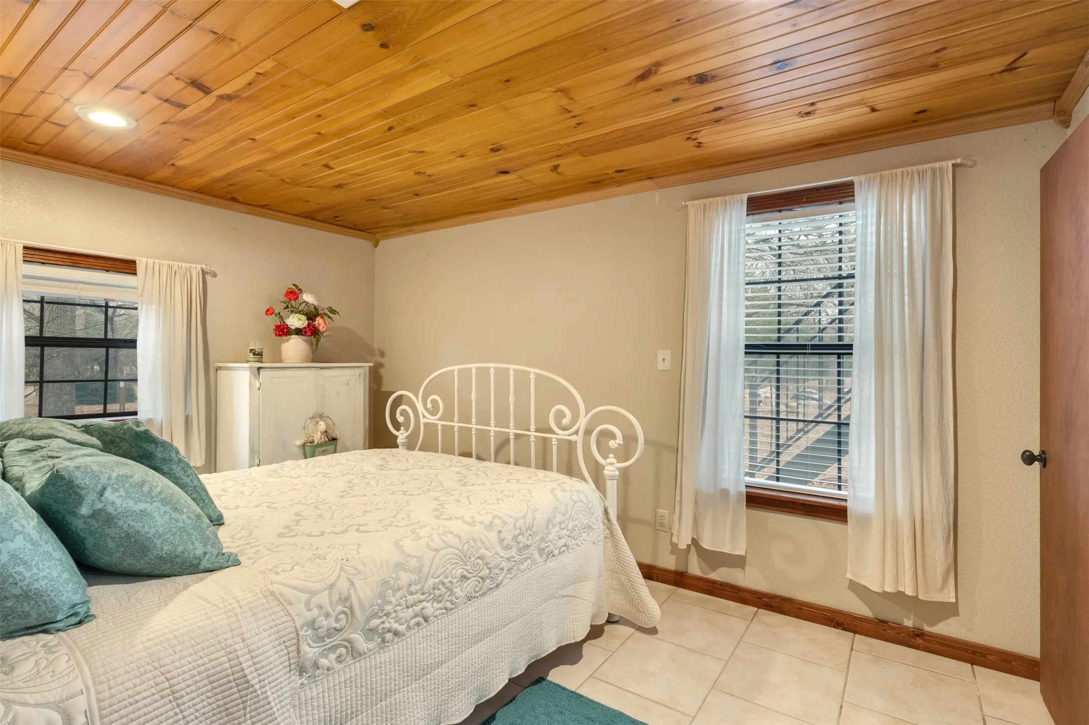 Wood-paneled ceiling with recessed lighting
