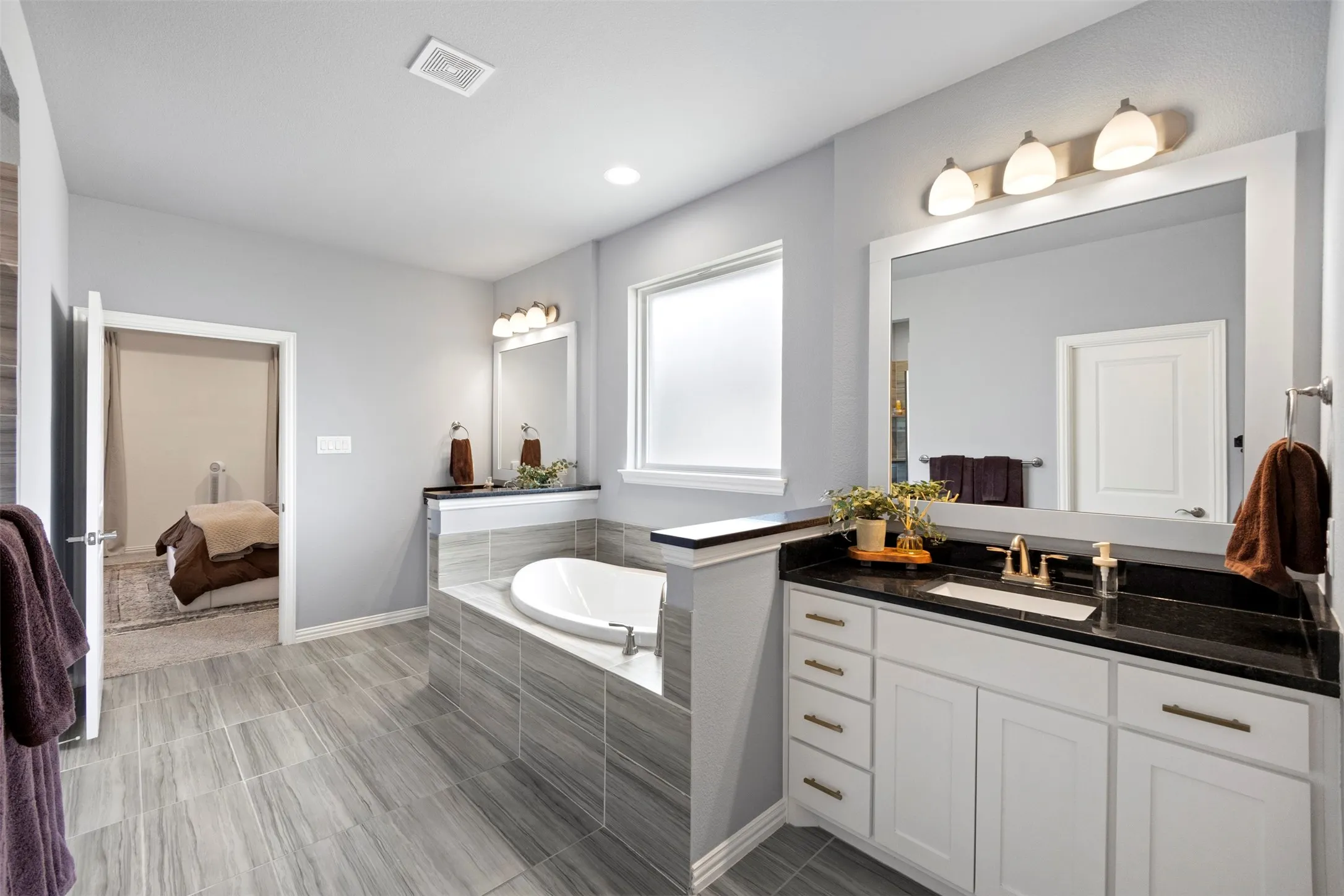 Spacious primary bathroom with soaking tub