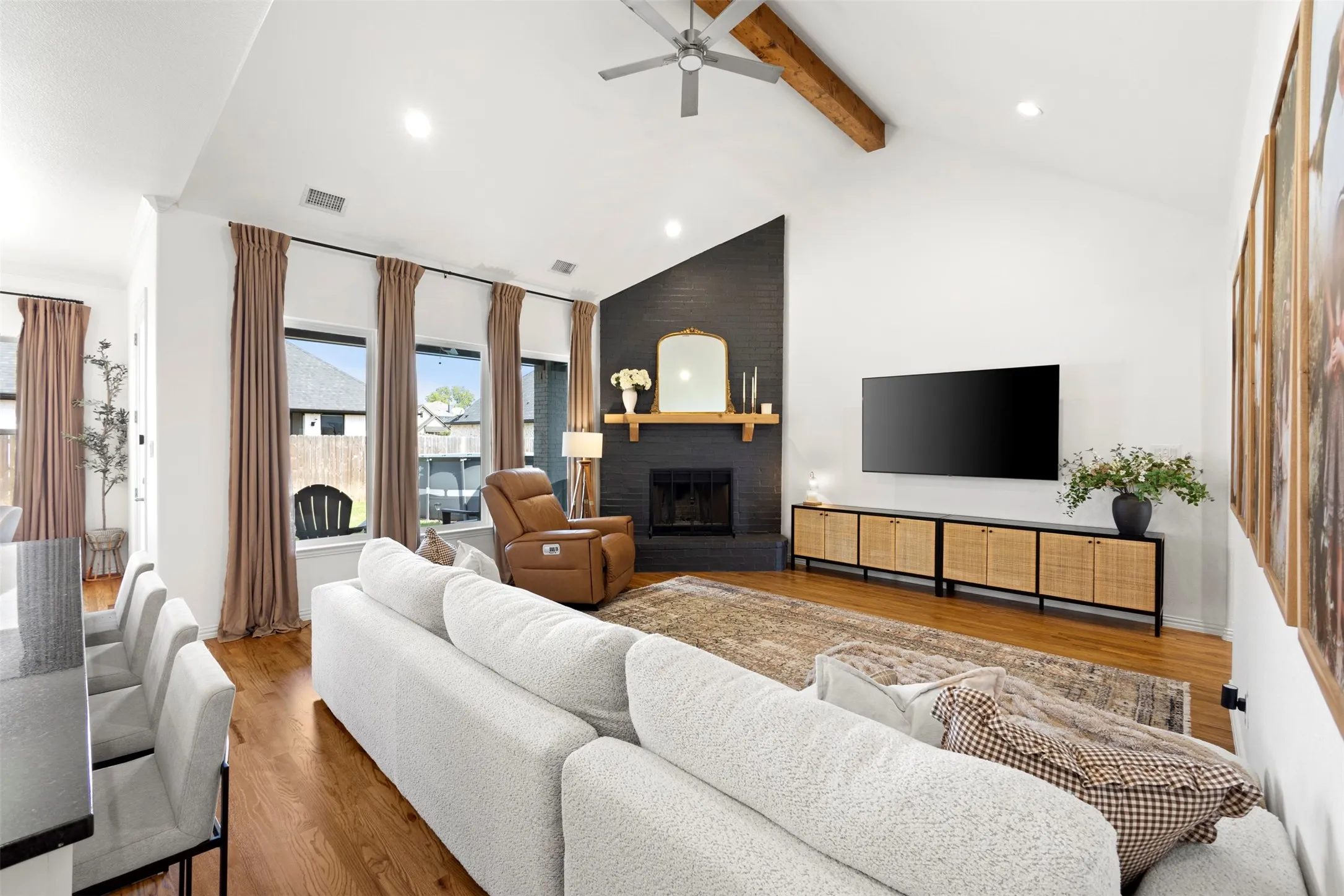 The vaulted ceilings and excellent natural light in the living rooms area make this the perfect space to relax or entertain friends and family