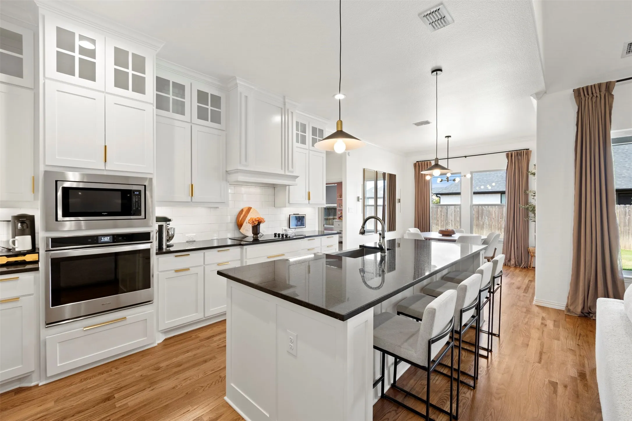 Wonderfully bright kitchen with beautiful granite counters and large island!