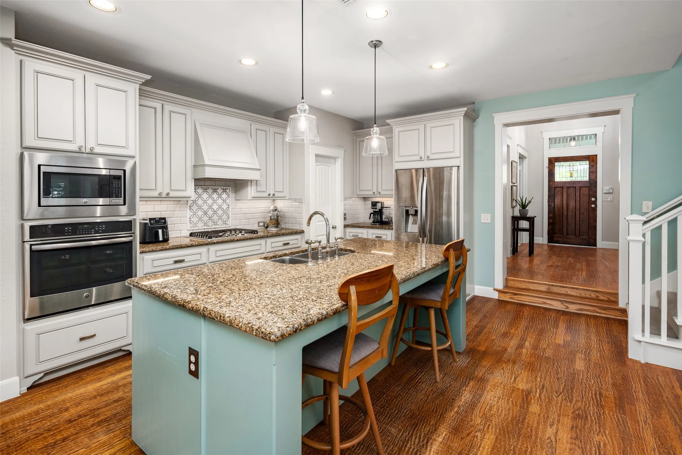 Kitchen features Electric Oven, Gas Cooktop, Vent to the outside, Walk In Pantry, large Island with seating.