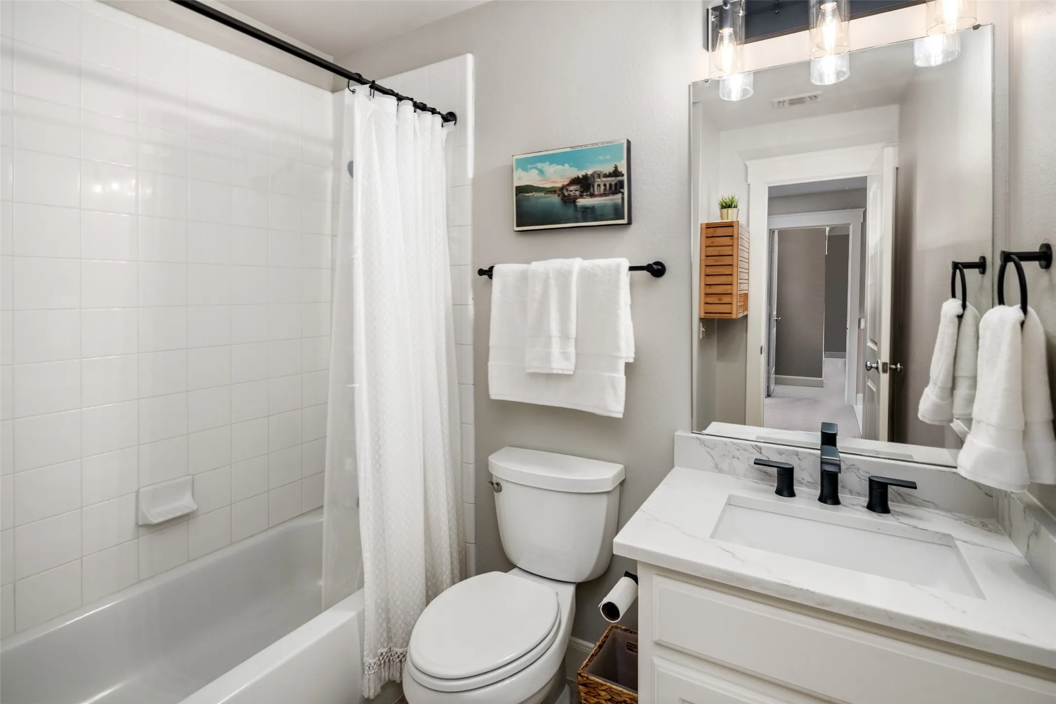 UPDATED Upstairs Full Bathroom Quartz Vanity, fixtures and decorative lighting.