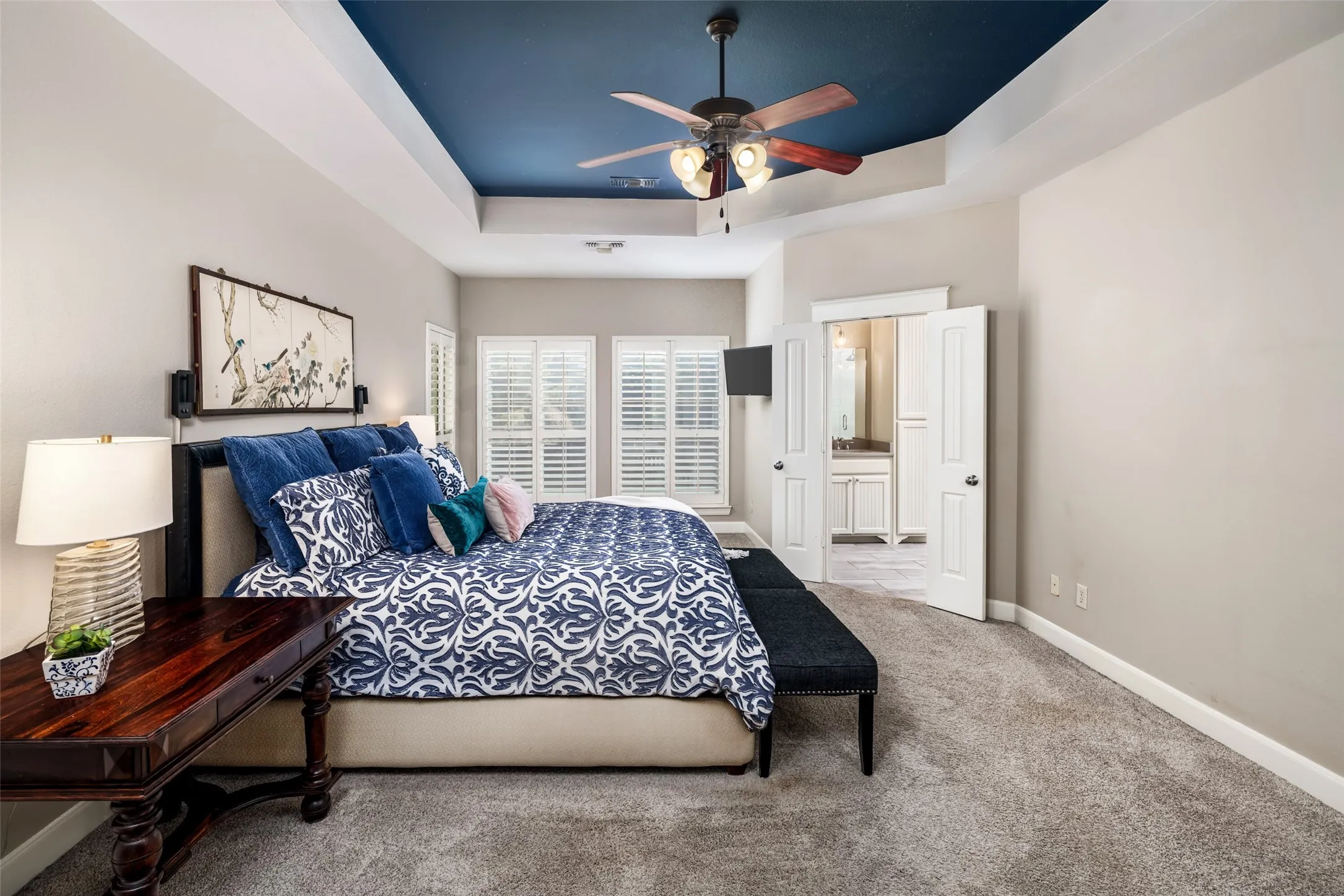 First floor Primary Suite is a serene retreat with Sitting Area, Views to the private backyard. Decorative Lighting and Plantation Shutters.