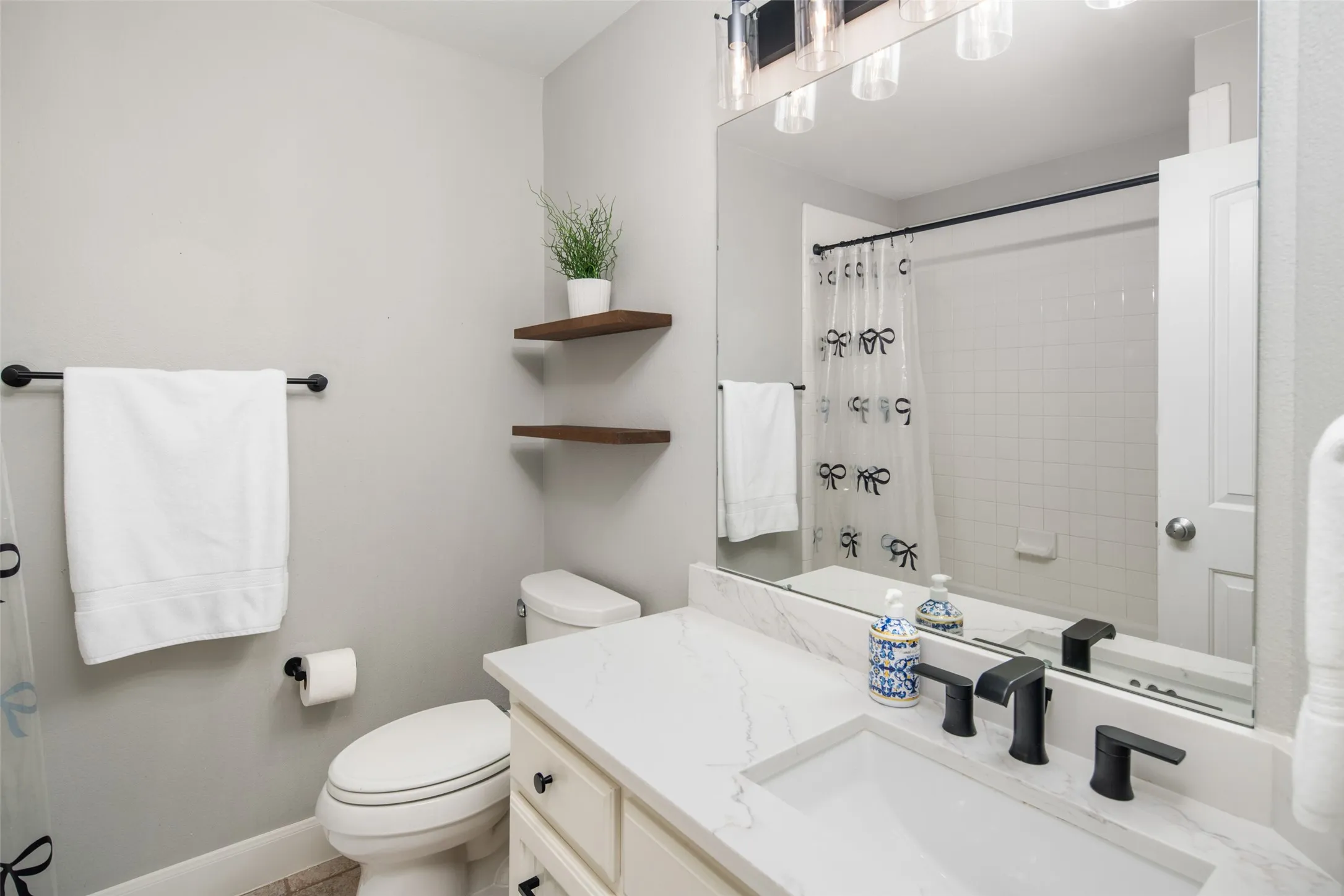 UPDATED 2nd Full Bathroom Upstairs with Quartz Vanity, updated fixtures, decorative lighting.