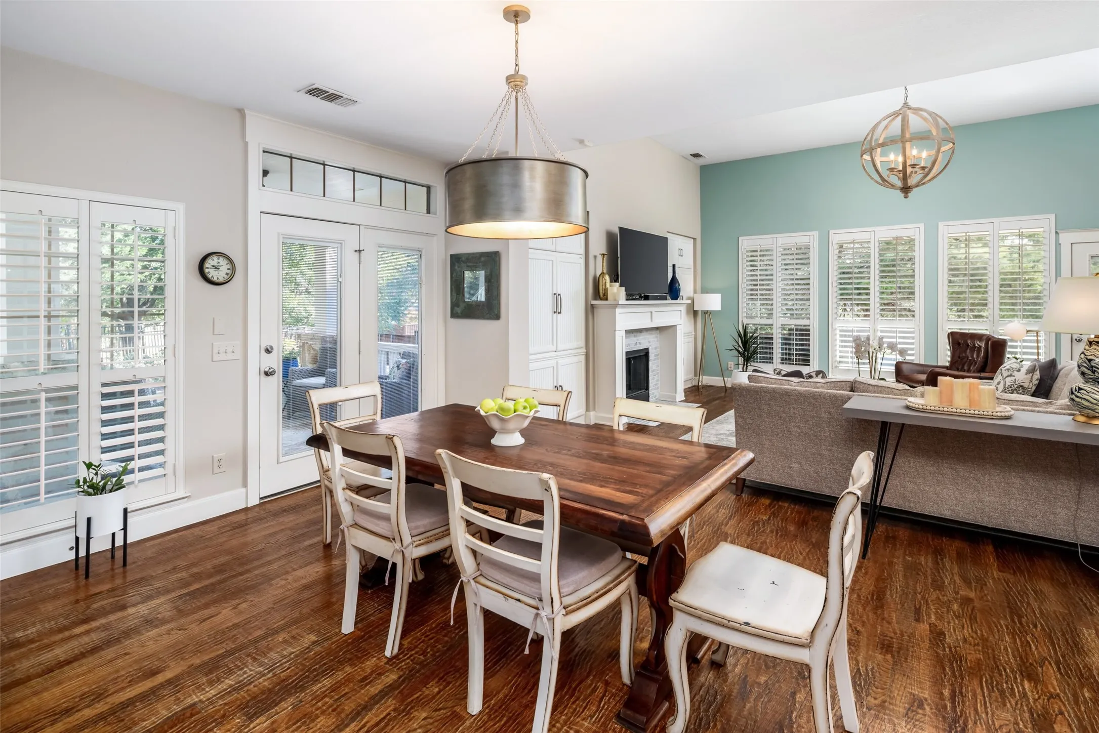 Breakfast Area has direct access to covered side patio, plantation shutters and beautiful views.