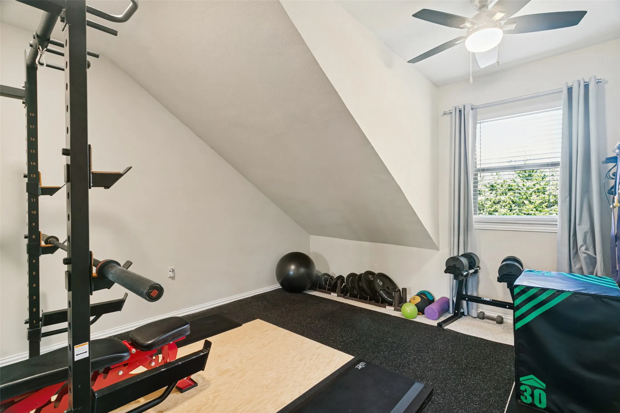 This bedroom is currently used as a gym.