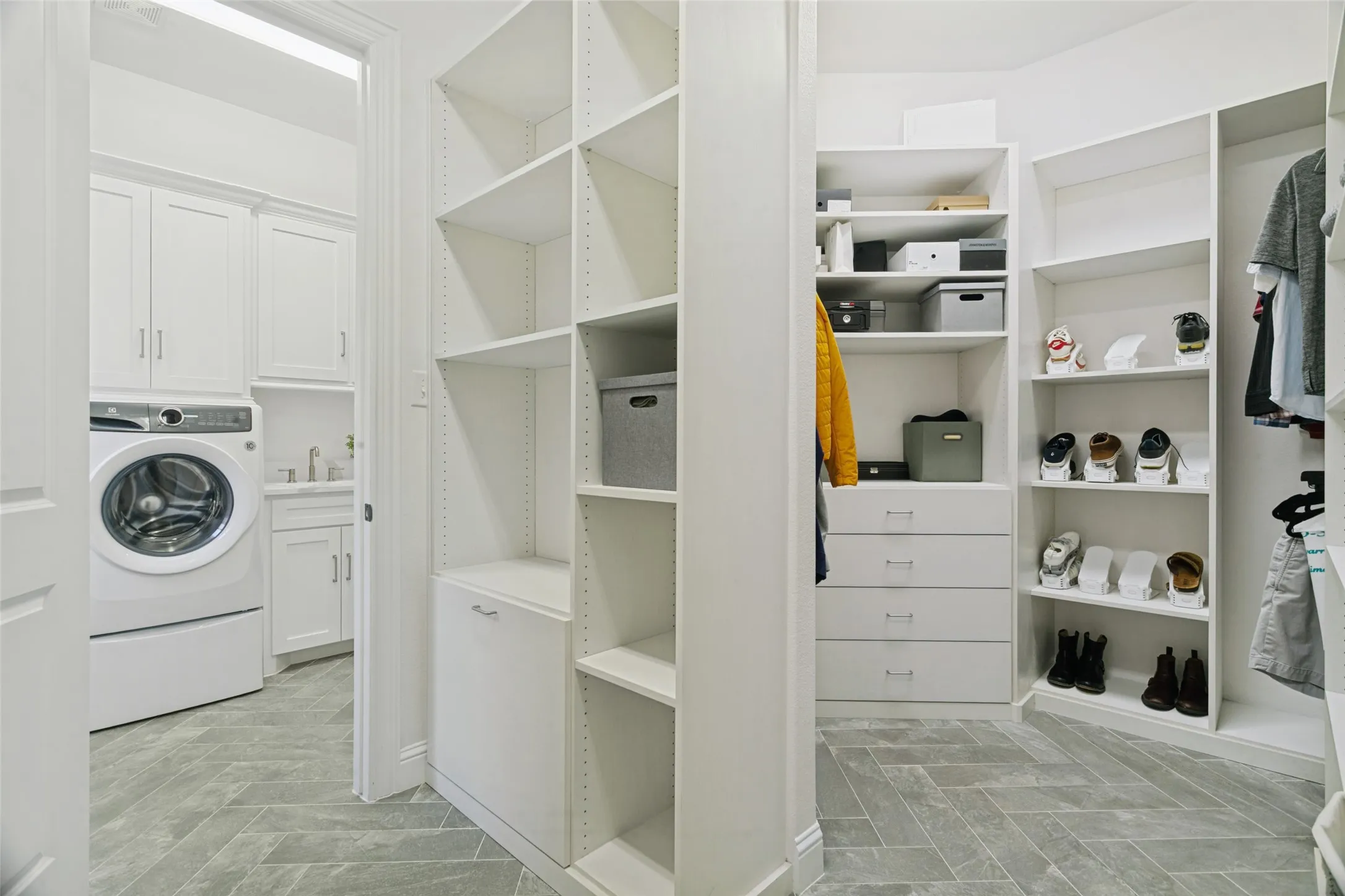 The walk-in primary closet has custom closetscaping, and walks through to the laundry for your convenience.
