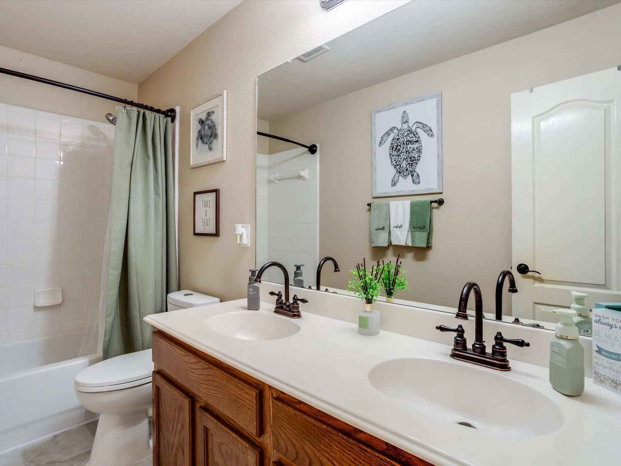 Double vanity with integrated sinks and oil-rubbed bronze fixtures
