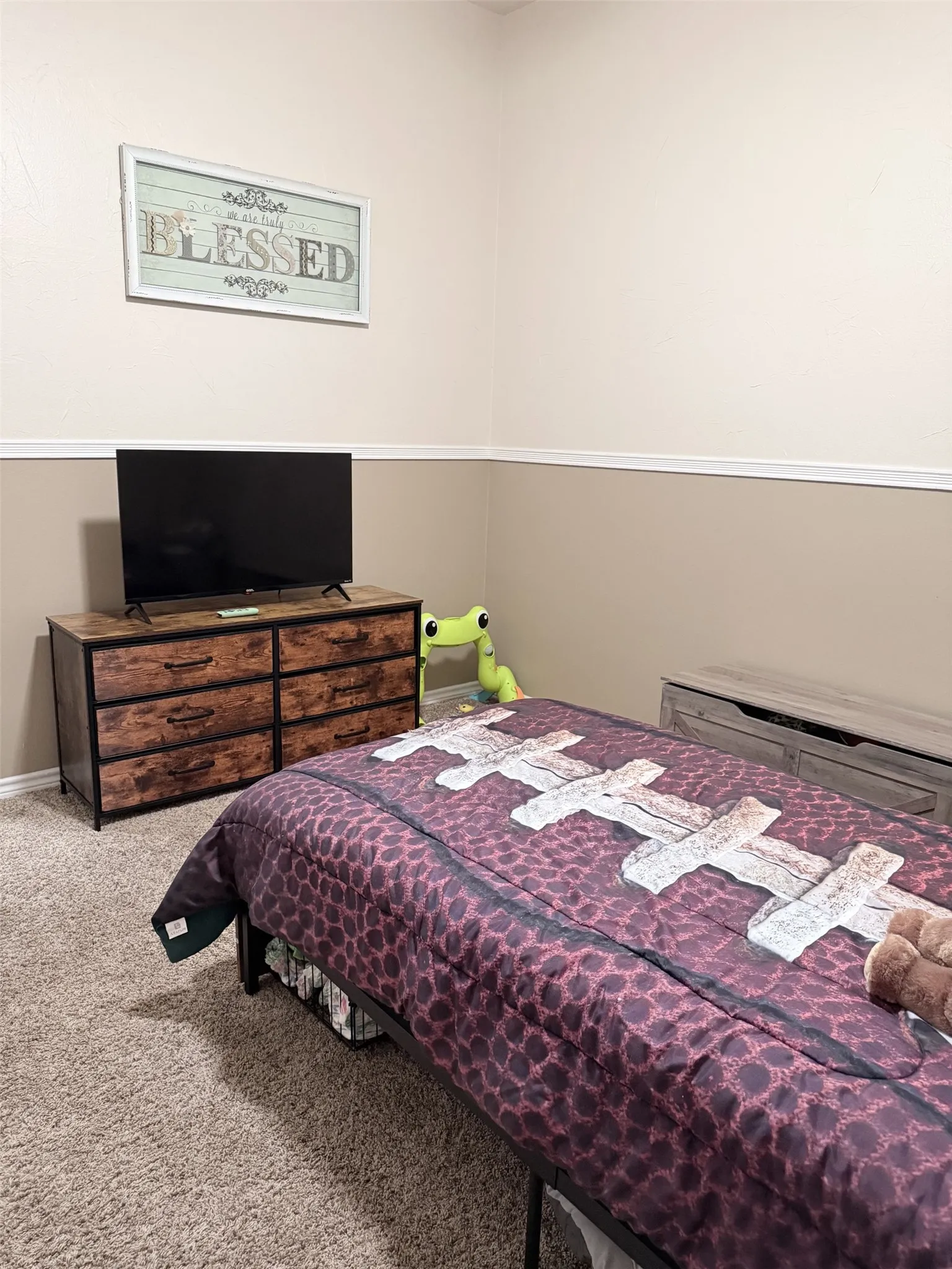 Wall-to-wall carpeting with two-tone wall paint and crown molding