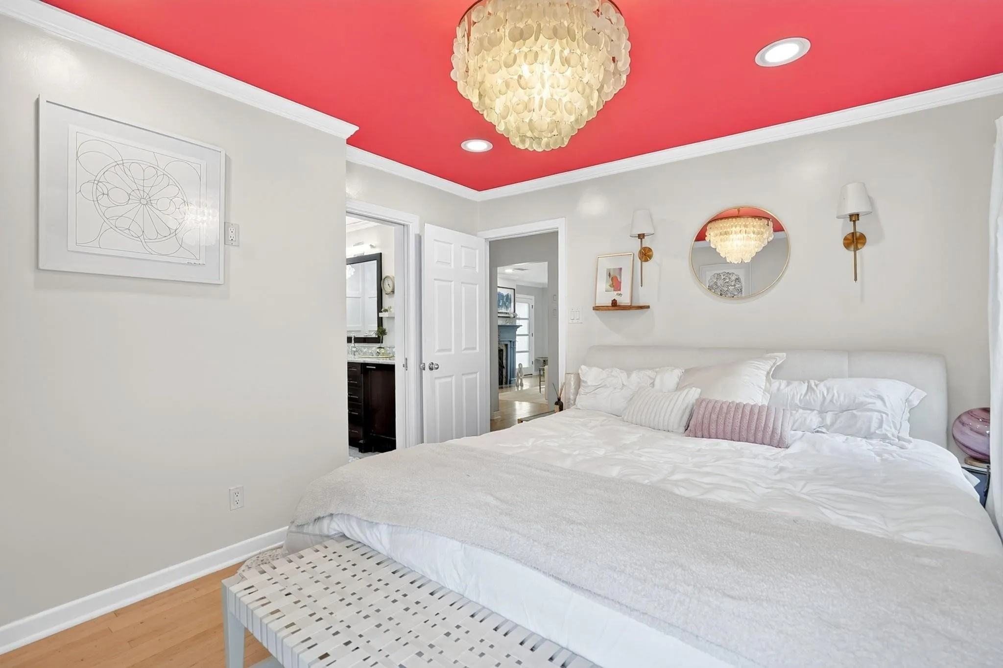 Recessed lighting, wood-finish flooring, and a decorative ceiling fixture
