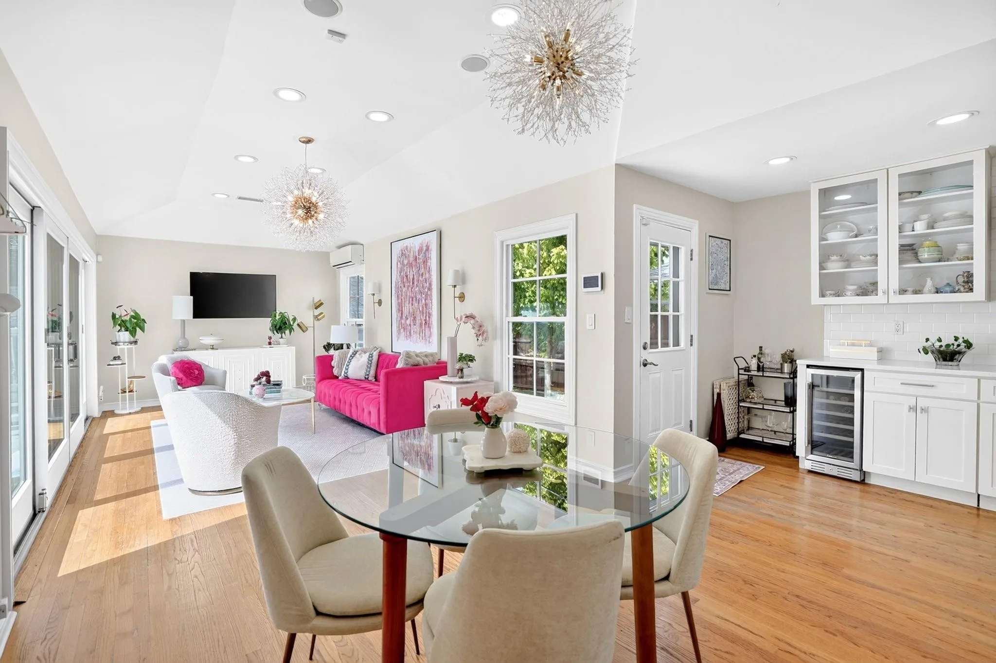 Hardwood flooring throughout, recessed lighting, and elegant ceiling fixtures