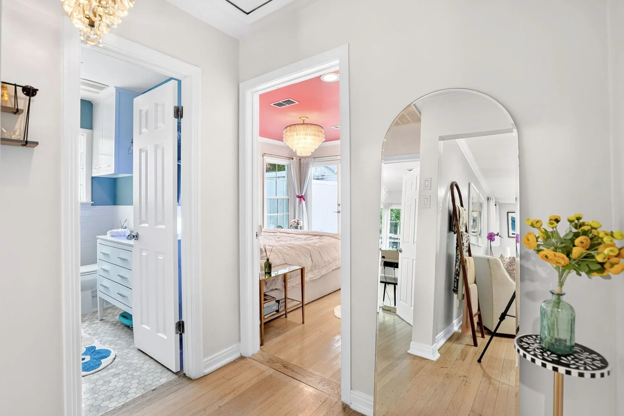 Light wood-finish flooring with white trim throughout