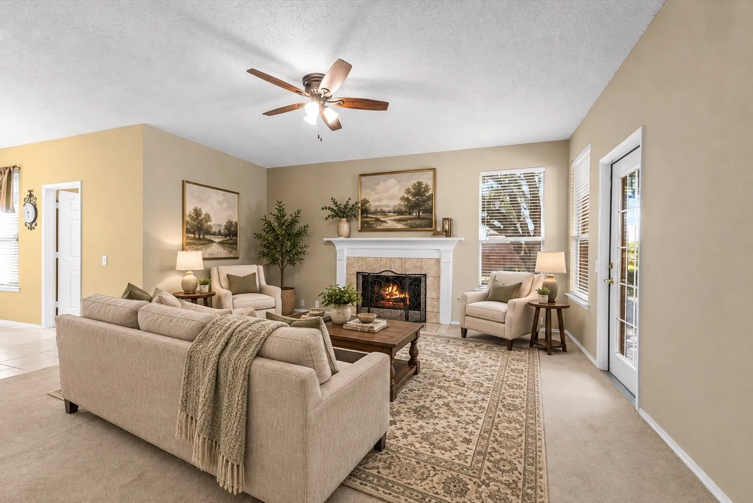 Living area featuring a ceiling fan, a fireplace with a mantel, a window with blinds, and French doors AI staged