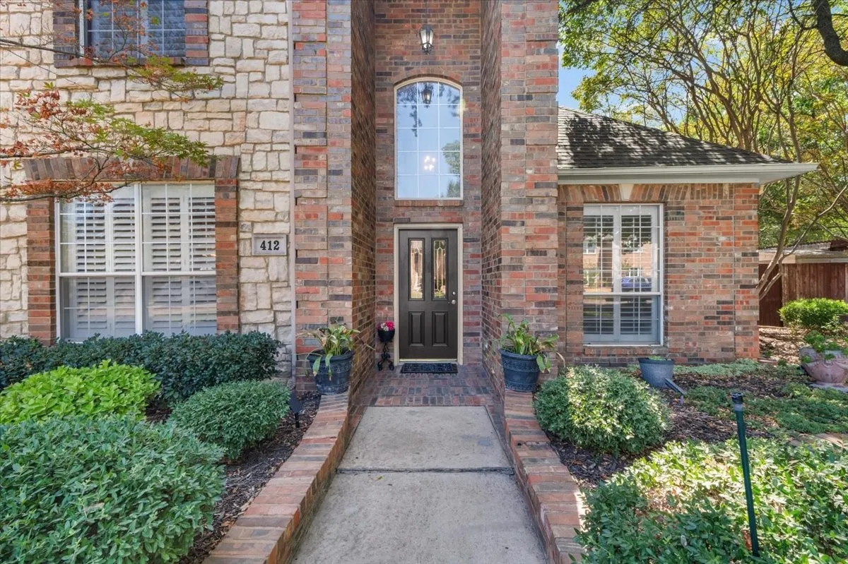 Stone and brick facade with a prominent entry door