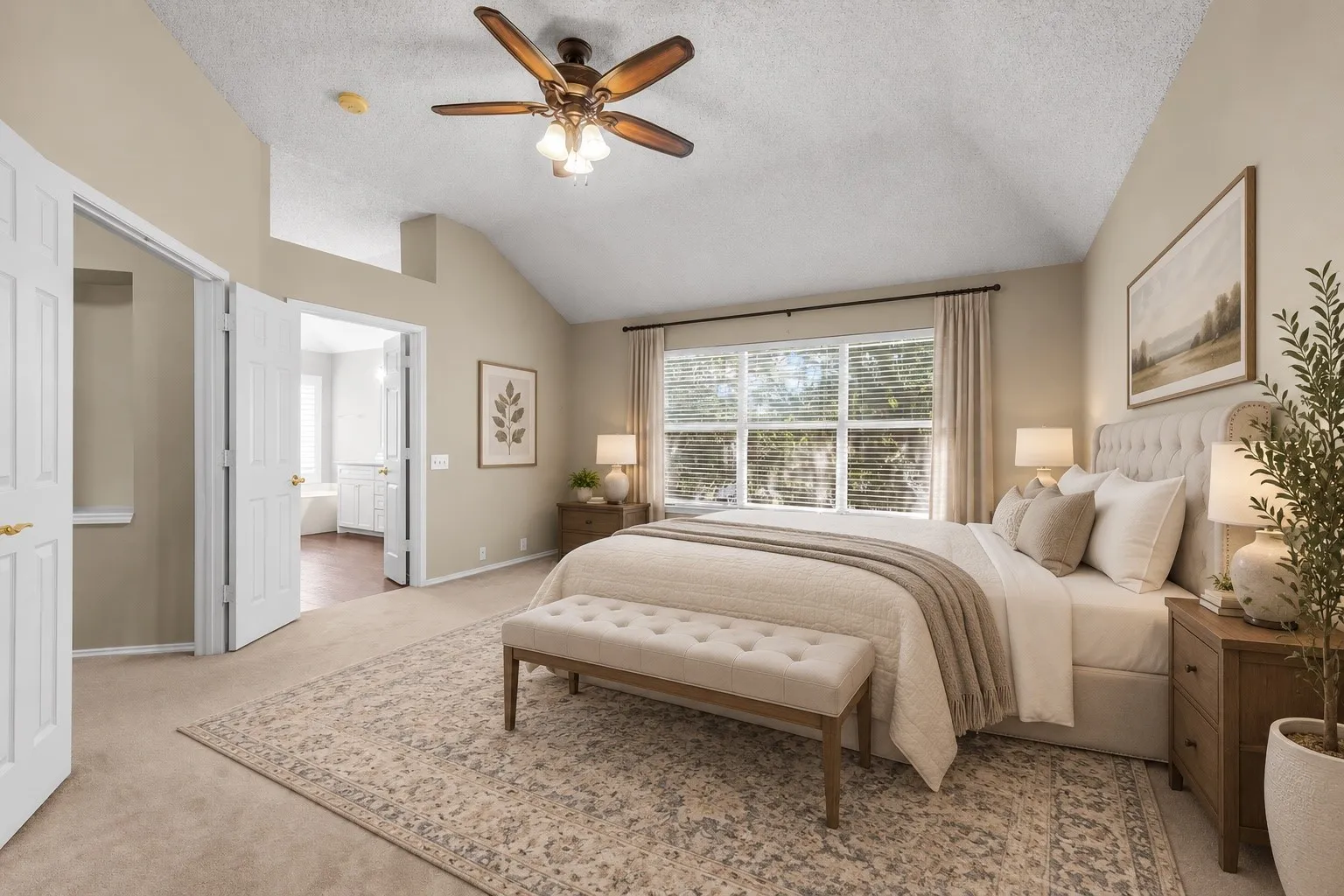 Vaulted ceiling with an attached ceiling fan, large window with blinds and drapes, and an open doorway leading to an additional space AI staged.