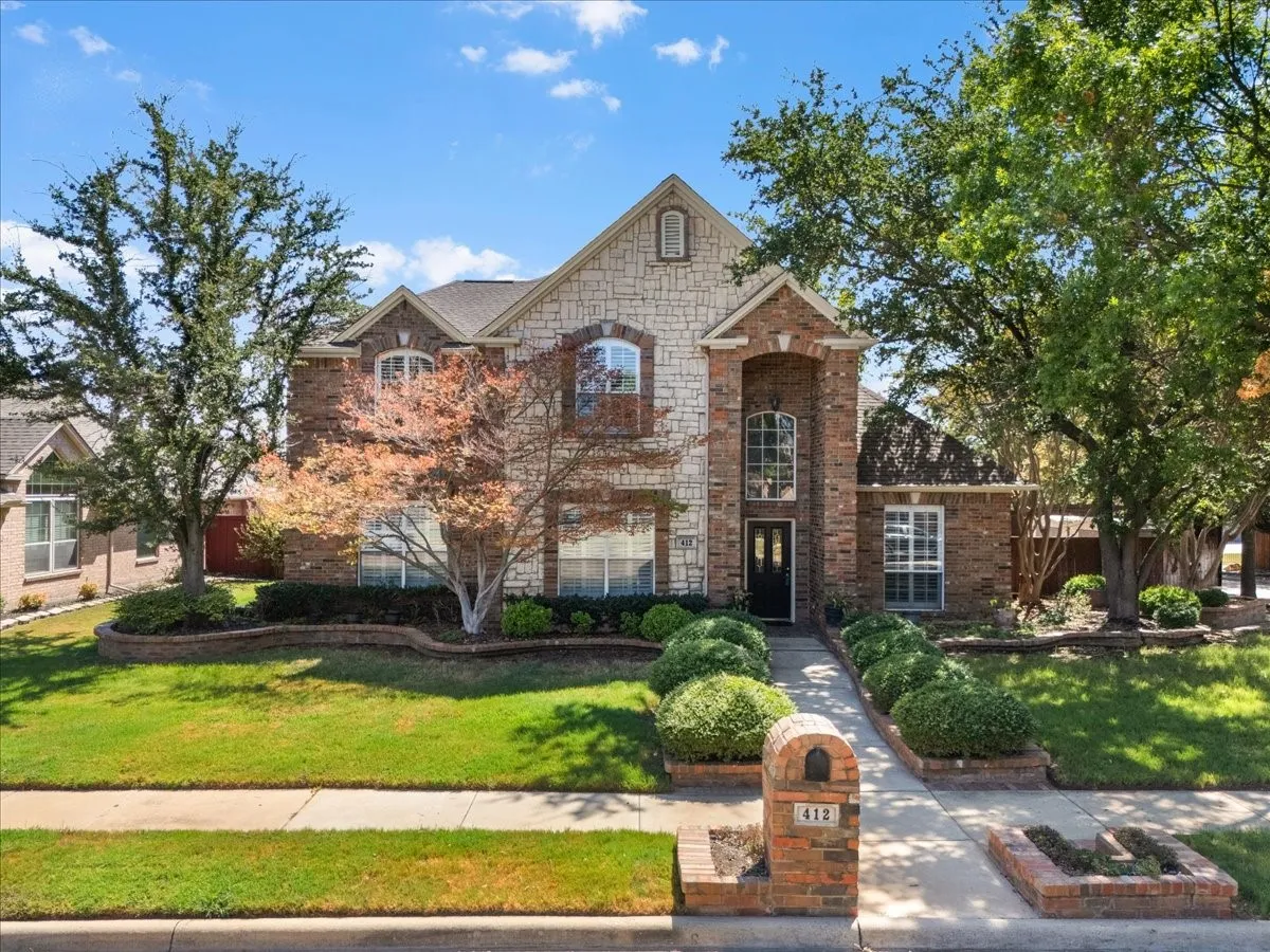 Stone and brick facade with an arched entry