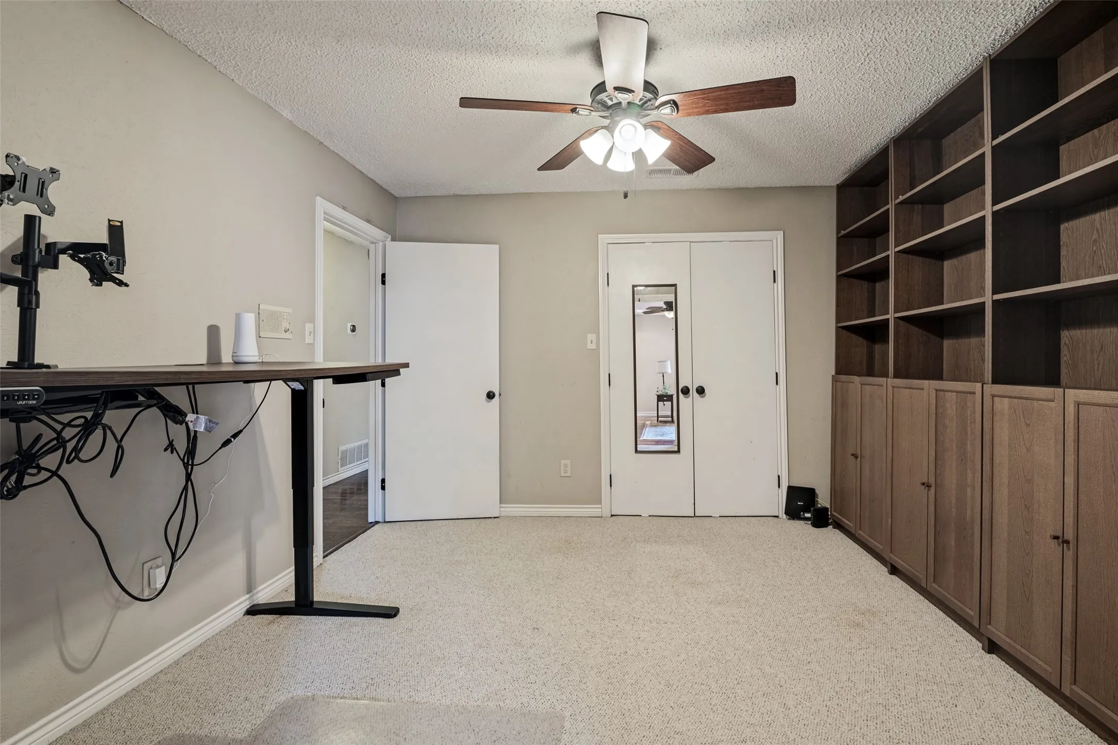 This 5th Bedroom makes a great office or playroom with shelving
