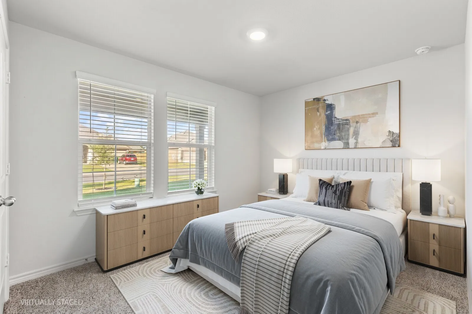Double windows with blinds, recessed ceiling lighting, wall-to-wall carpeting, and a white paneled headboard (virtually staged room 1)