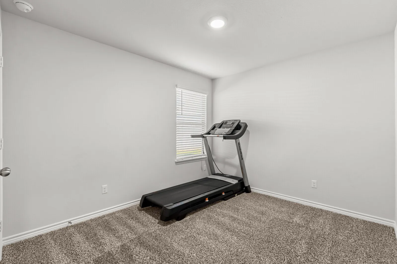 Neutral wall finishes, recessed lighting, and carpeted flooring (actual room 2)