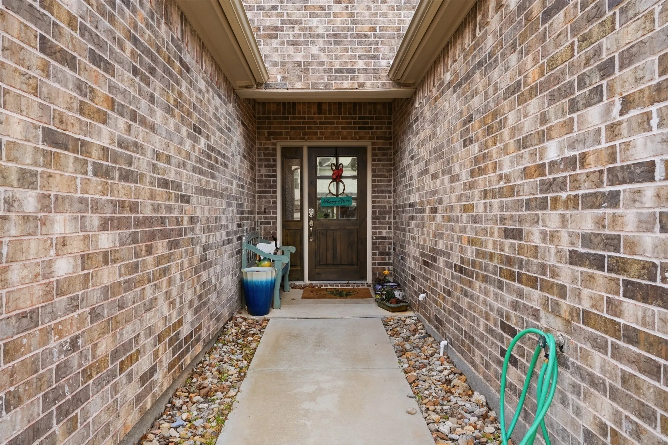 Brick exterior with a covered entry