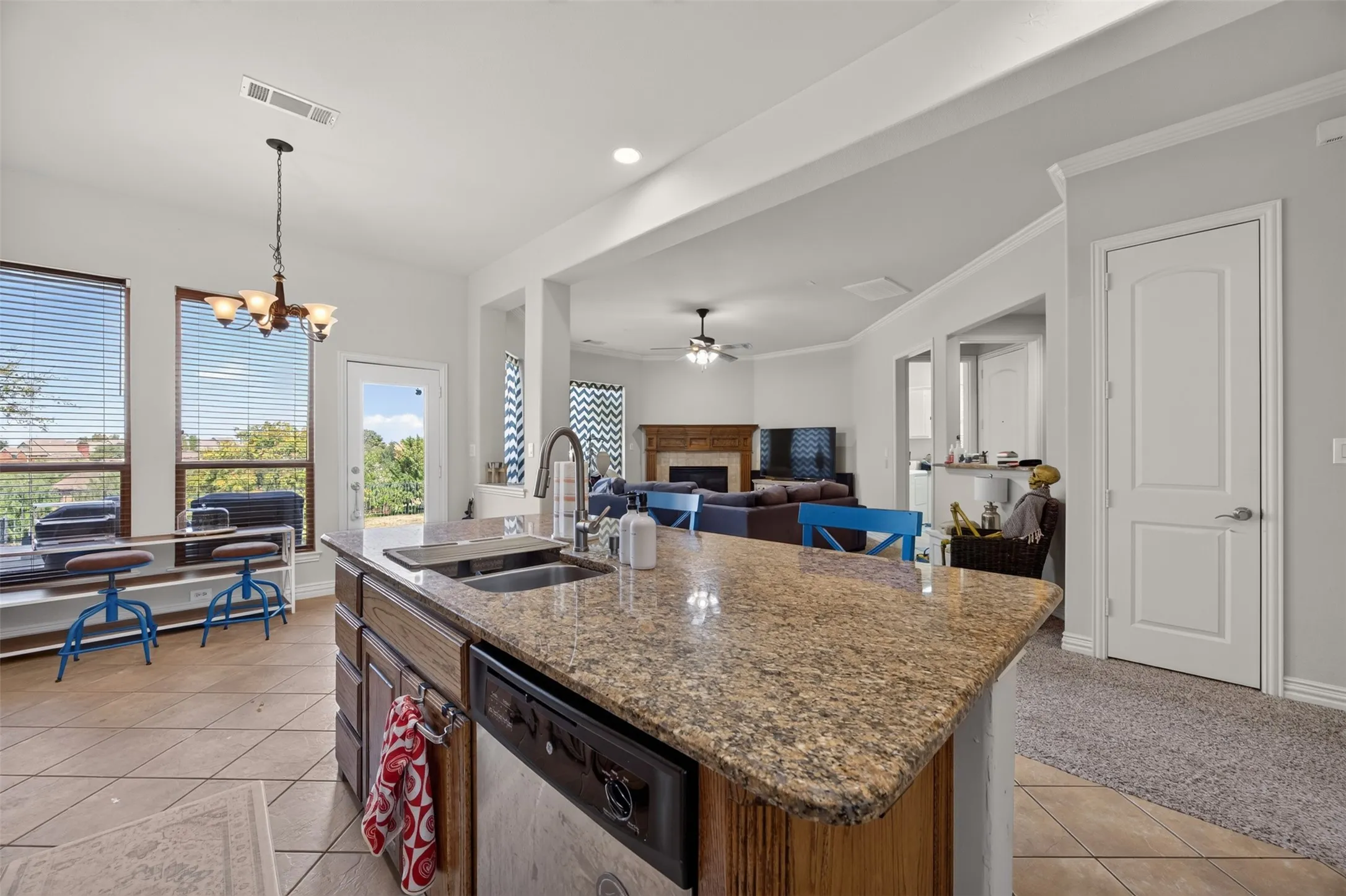 Kitchen island with a granite countertop and built-in sink