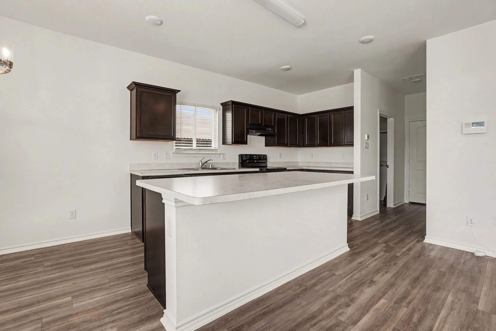 The kitchen island adds prep space and a natural gathering spot.