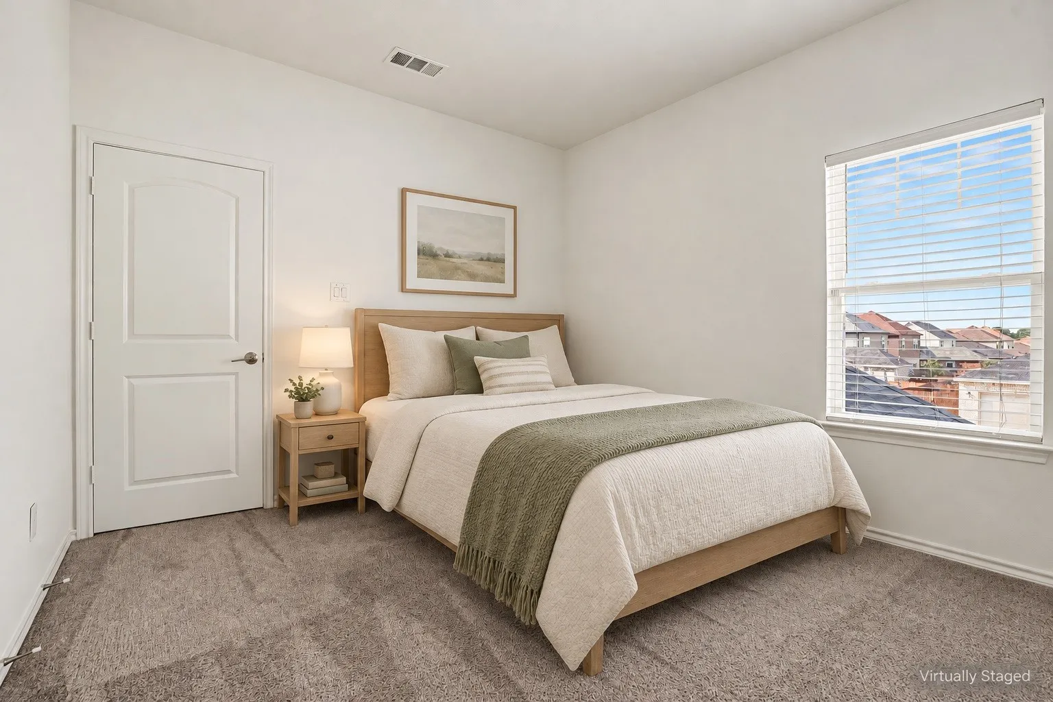 Virtually staged as a guest bedroom, showing one possible furniture layout with space for a bed and bedside table.