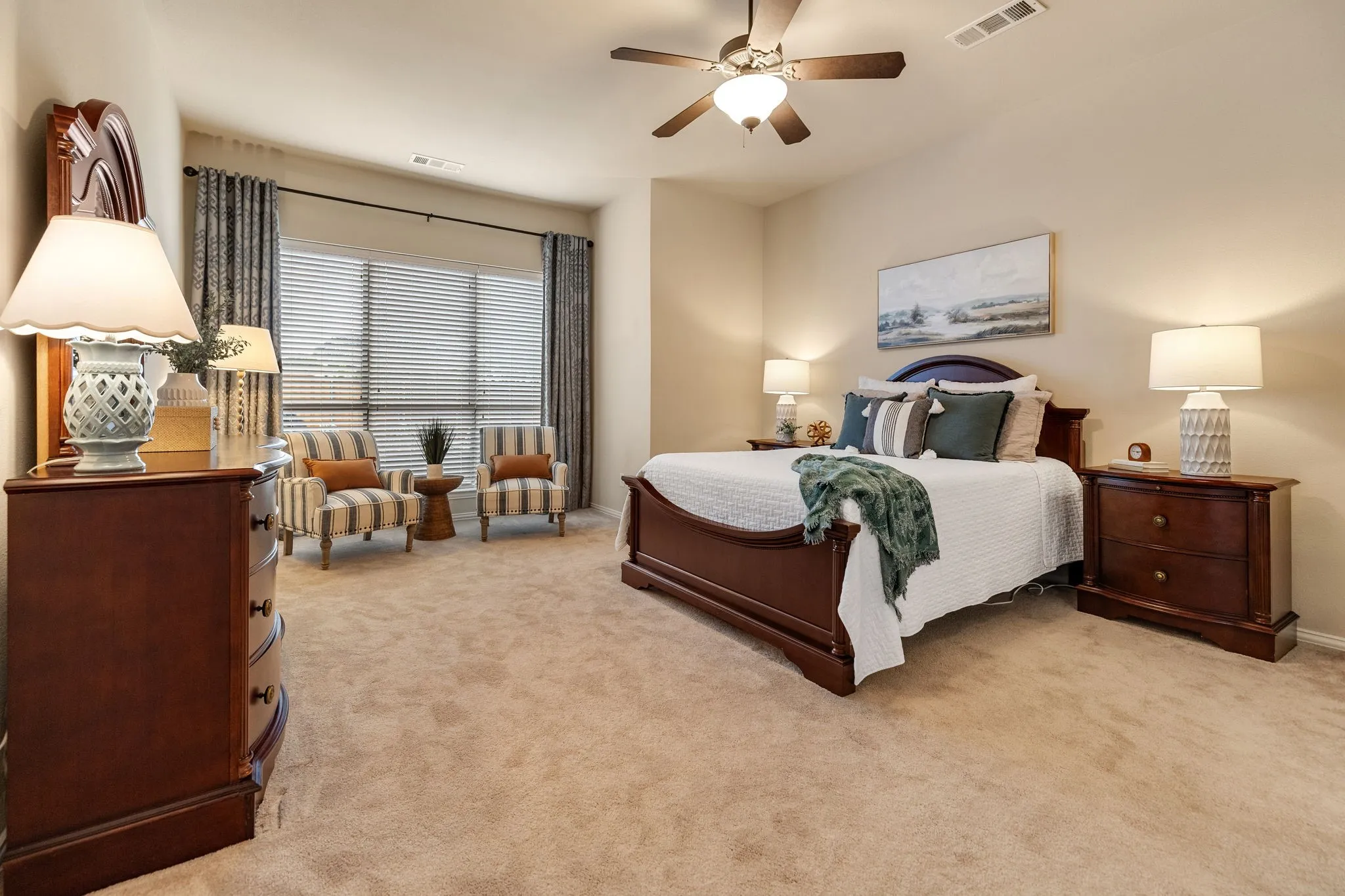 Come on in to the primary bedroom!  Tons of room and even a recessed area perfect for a sitting area or even a couch or loveseat.