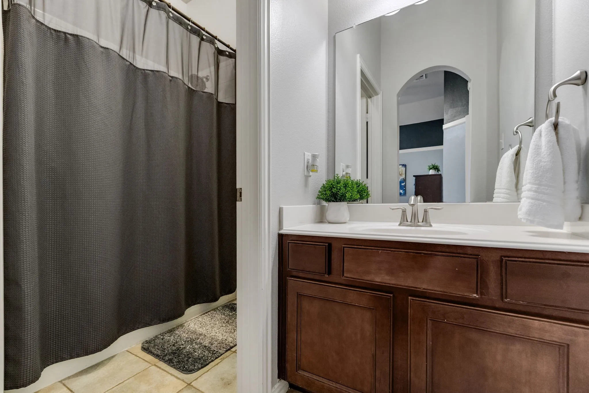 This is the attached vanity area and bathroom attached to upstairs bedroom number two in the previous photo.