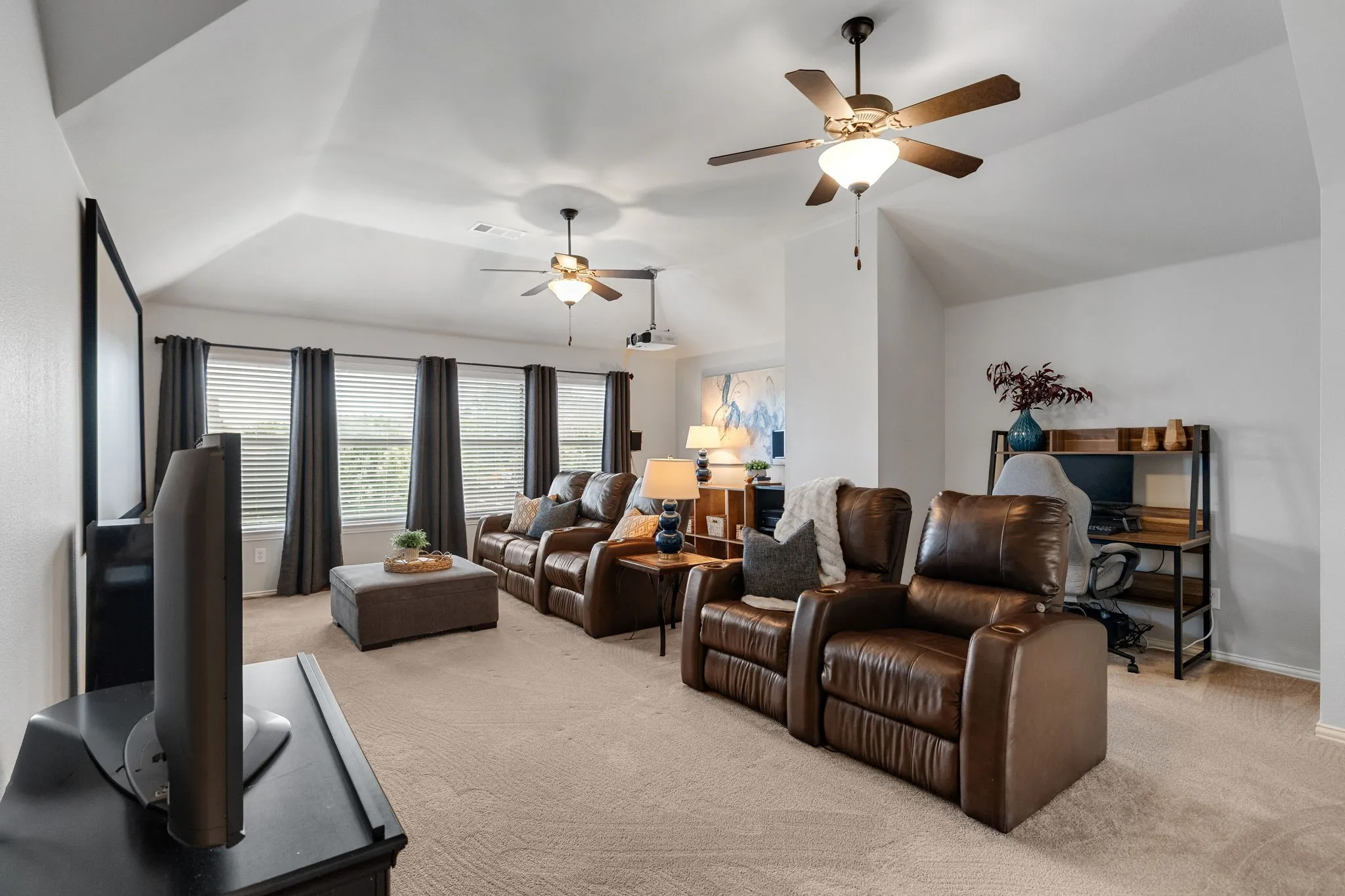 Two recessed nooks at the back of the room are perfect for storage, a desk area, etc.