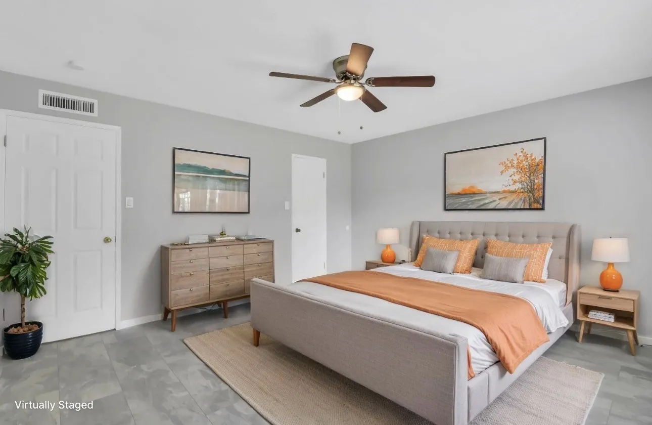 Bedroom with light gray walls, gray tile flooring, and a ceiling fan with integrated lighting