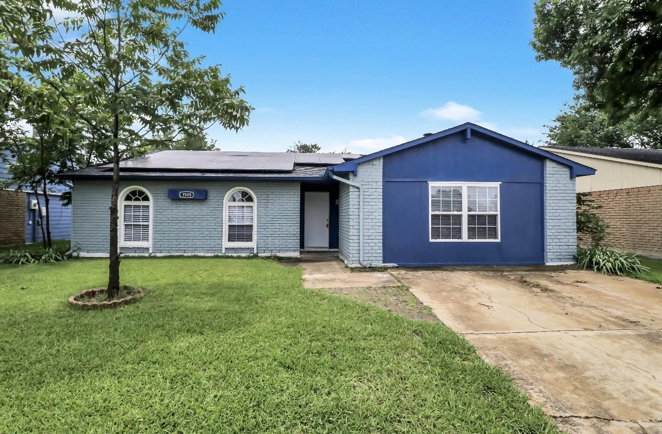 Brick exterior with blue siding accents