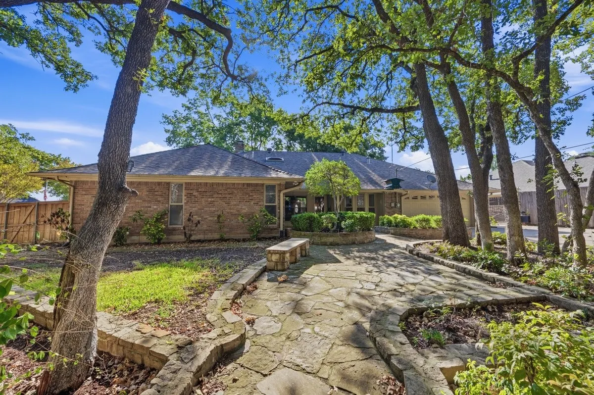 Brick exterior with a shingle roof