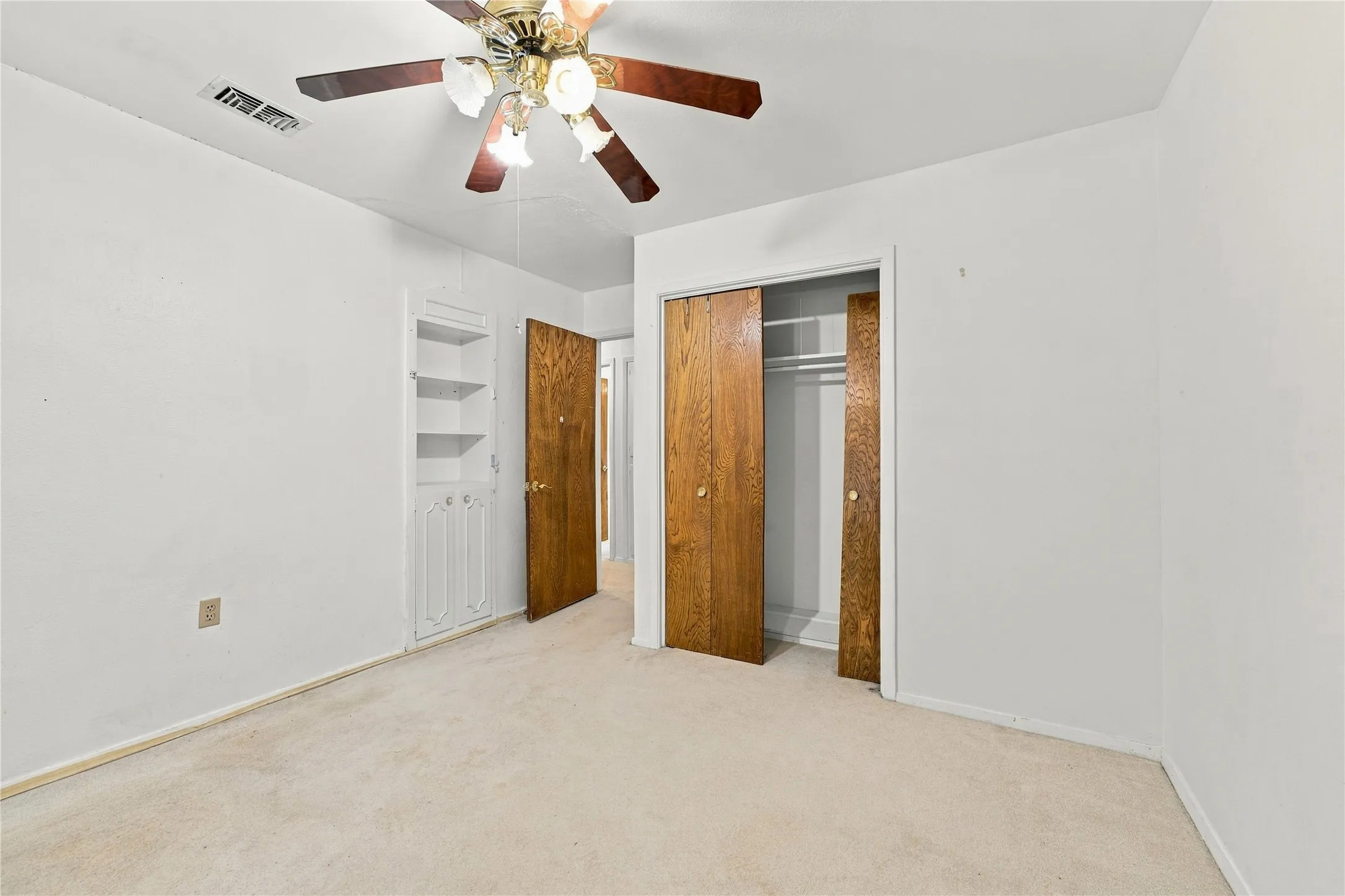 Wall-to-wall carpeting and neutral wall tones