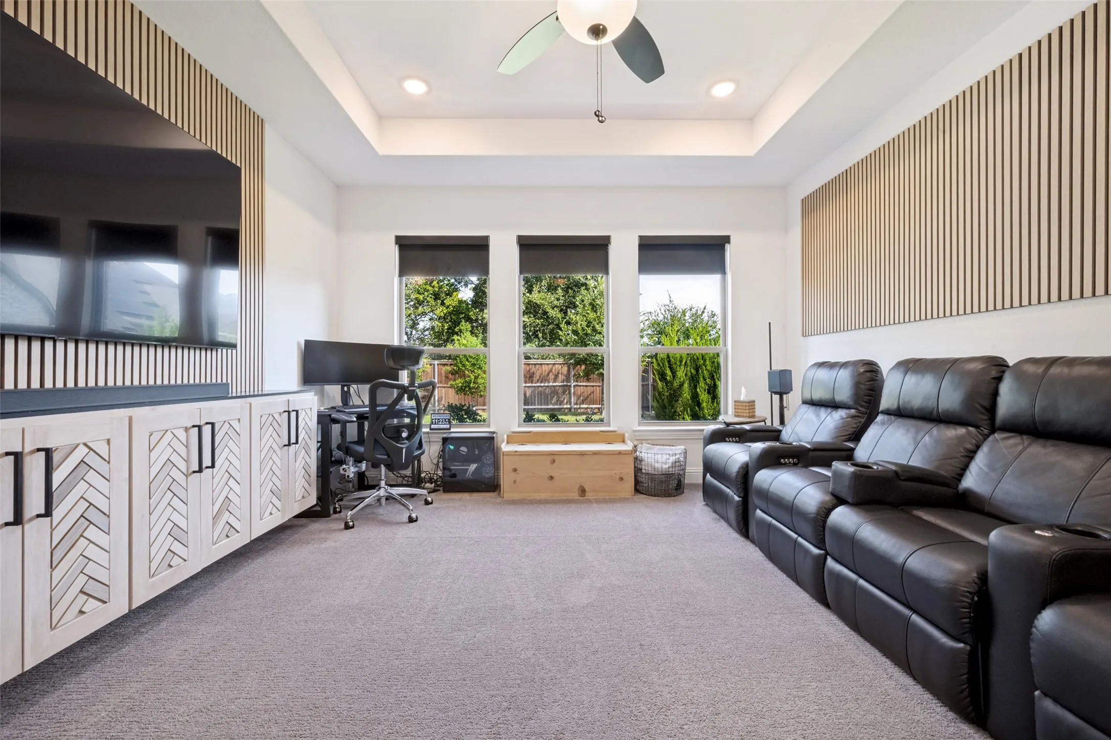 85" TV, leather theatre seating, custom built-ins, surround sound and sound bar with electric power shades
