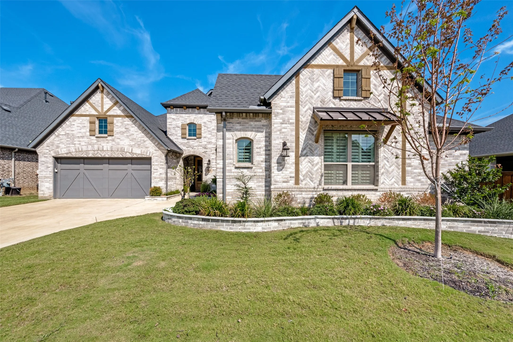 Brick and stone exterior with architectural shingles