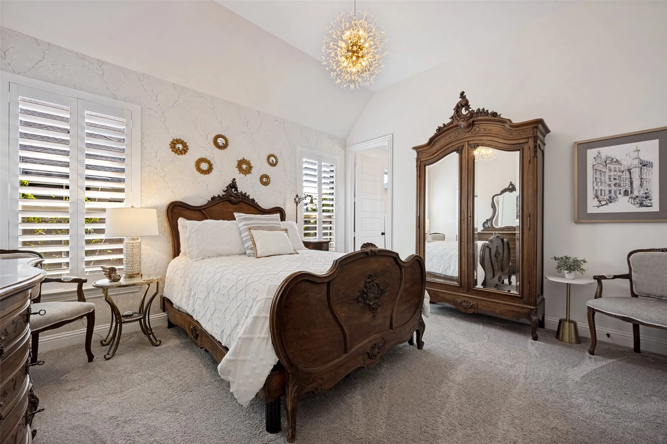 Vaulted ceiling, decorative chandelier, plantation shutters, textured accent wall, and soft carpeting