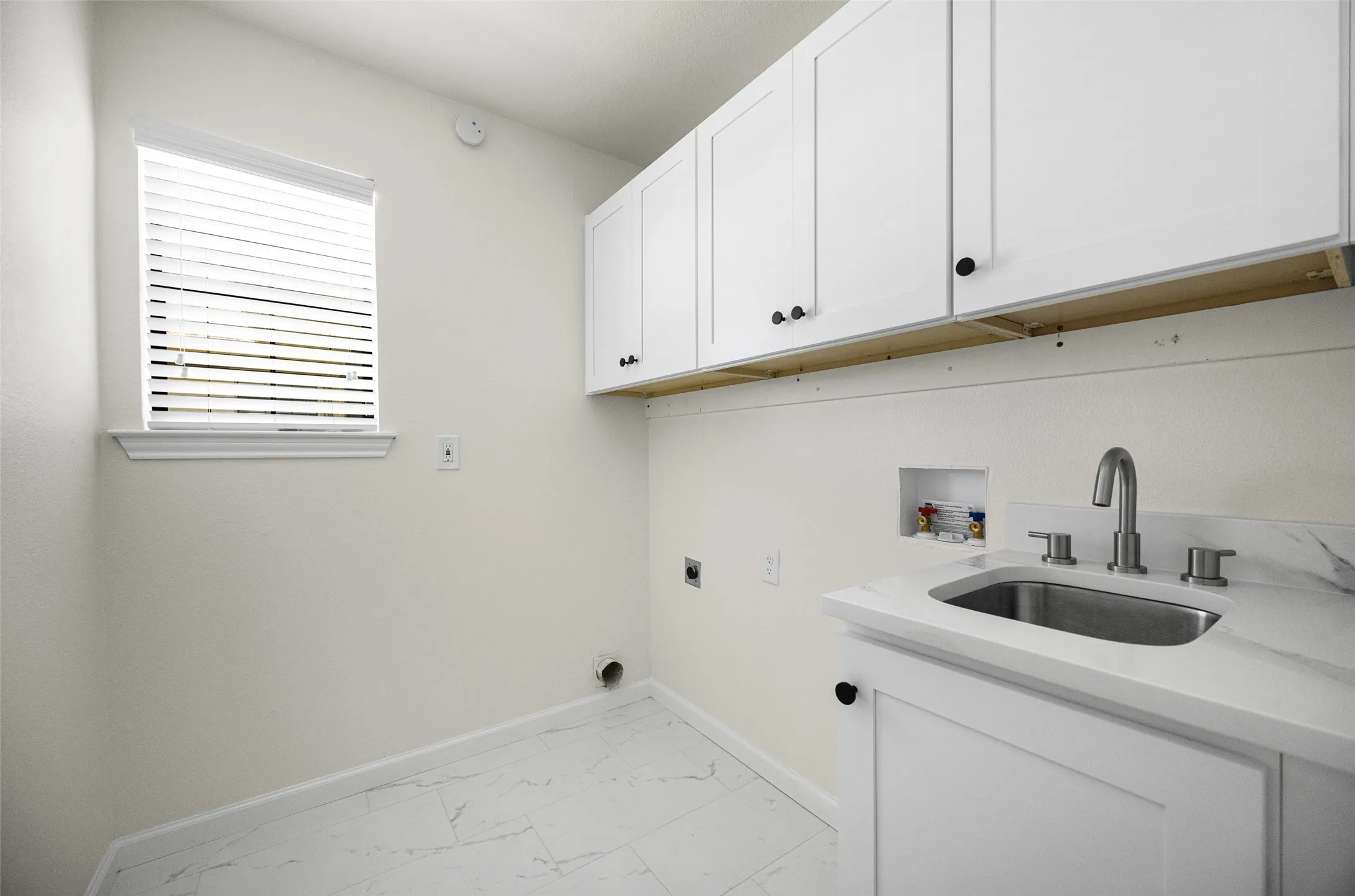 Laundry room with brand new built-in cabinetry